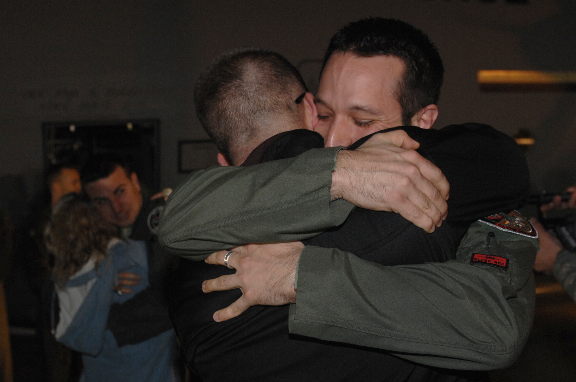 ROYAL AIR FORCE LAKENHEATH, England -- Capt. Tyler Stark hugs his brother Trevor upon returning to RAF Lakenheath, England March 26, 2011.  The two aircrew members, whose F-15E Strike Eagle went down over Libya during Operation Odyssey Dawn, were greeted by their family and friends.  The 48th Fighter Wing provides all-weather, day-or-night air superiority and air-to-ground precision combat capability as well as combat search and rescue.   (U.S. Air Force photo by Tech. Sgt. Lee A. Osberry Jr./Released)