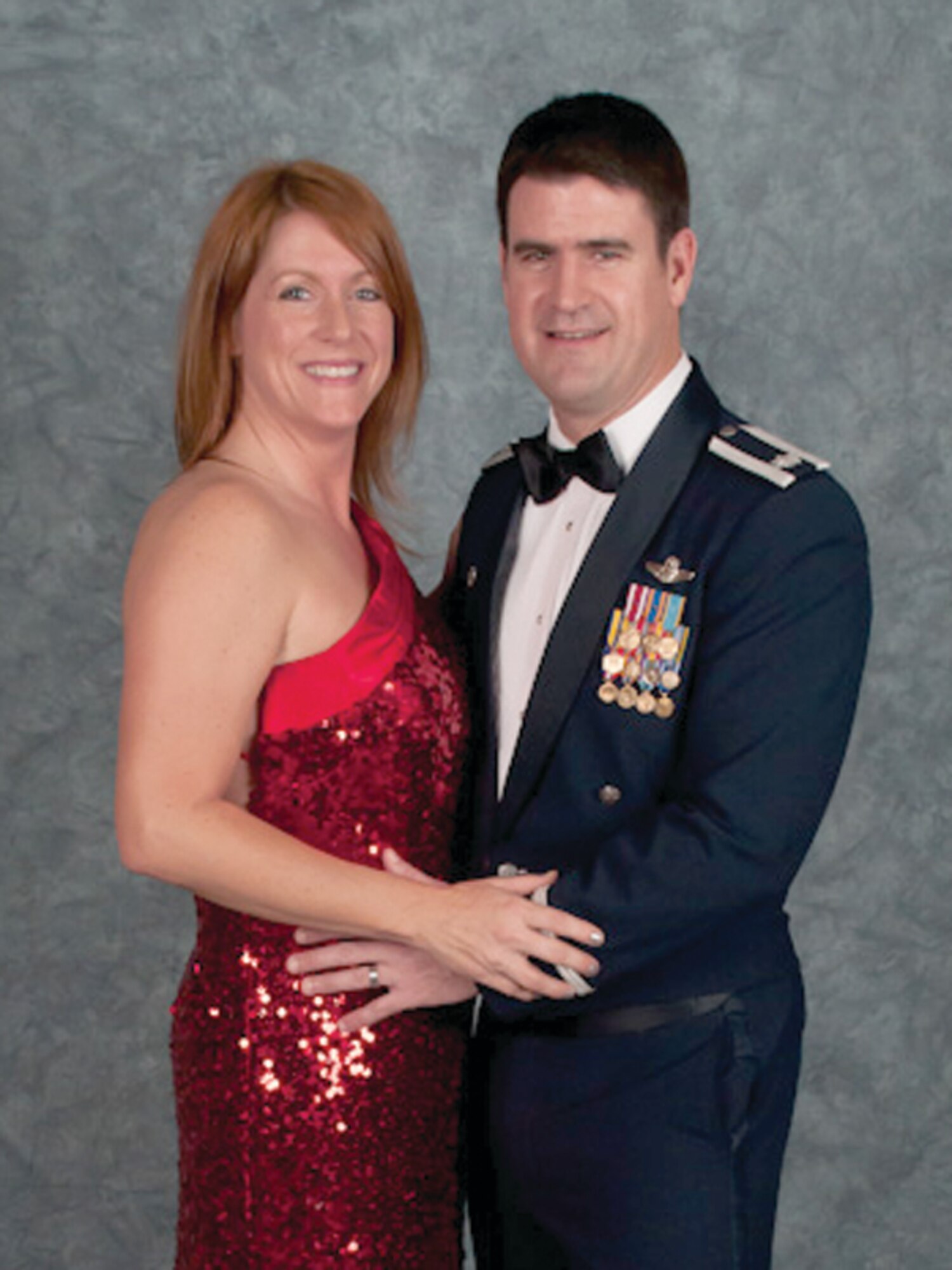 Trish Dotson and her husband, Lt. Col. Robert Dotson, 65th Operations Support Squadron commander, pose during the 65th Air Base Wing Annual Awards Banquet, Feb. 25, at the Top of the Rock Club. Mrs. Dotson is an extremely active volunteer, and consequently won the United States Air Forces in Europe 2011 Joan Orr Spouse of the Year award.  (Courtesy Photo)