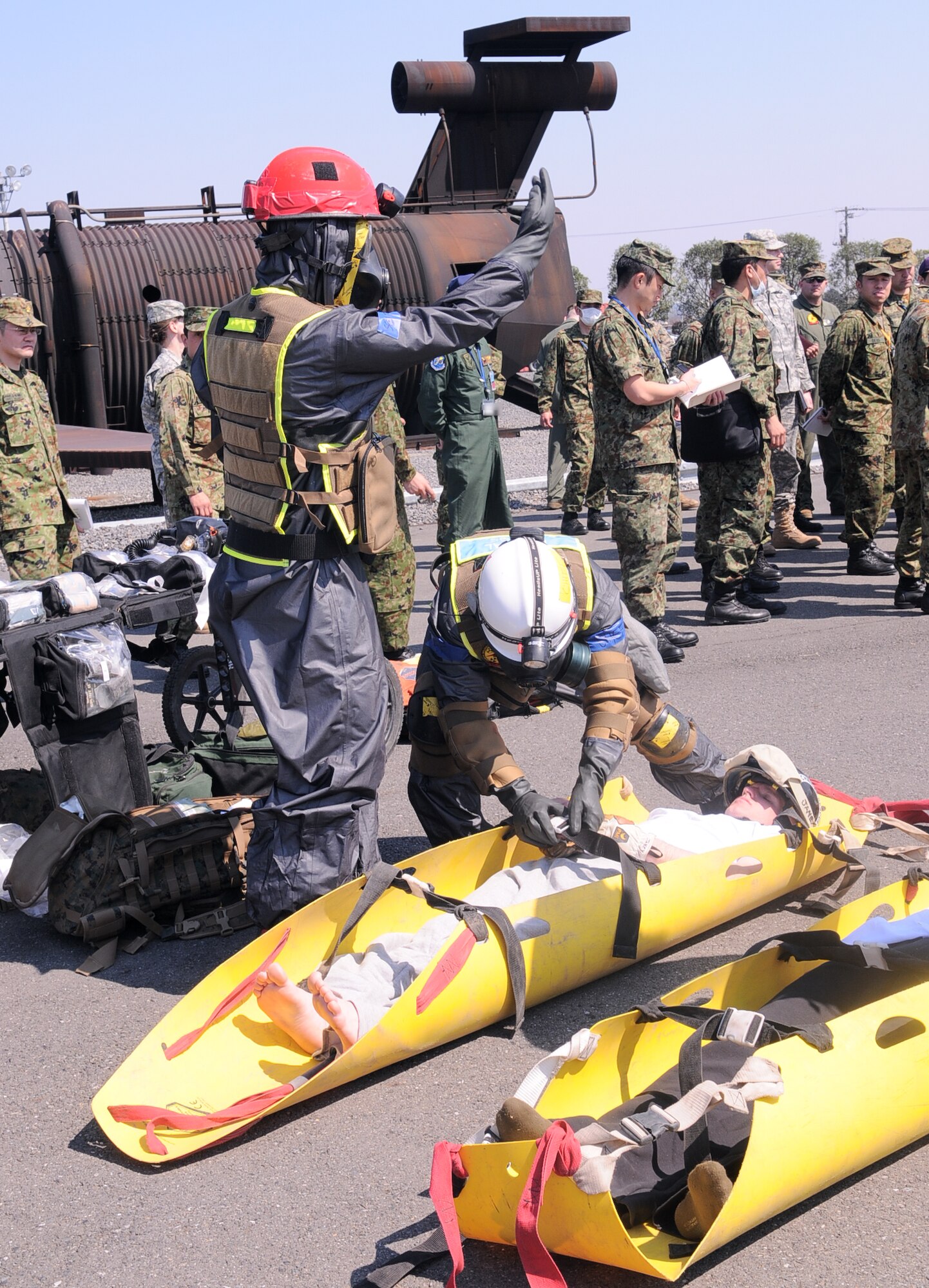 YOKOTA AIR BASE, Japan -- Marines from Naval Support facility, Indian Head, Md., demonstrate their capabilities to Japan Ground Self-Defense Force members at Yokota Air Base, Japan, April 6, 2011. The initial response force members are here to assist JGSDF. (U.S. Air Force/photo Airman 1st Class Krystal M. Garrett) 