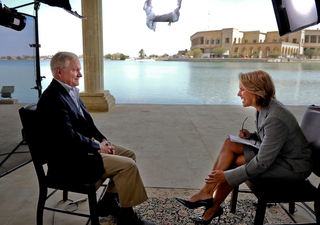 U.S. Defense Secretary Robert M. Gates takes part in an interview with "CBS Evening News" anchor Katie Couric during a trip to Camp Victory, Iraq, April 7, 2011.