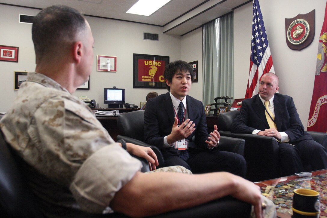 Fumiya Sato, an undergraduate from Waseda University and newly-hired intern for Community Policy, Planning and Liaison Office (G-5), talks to Maj. Gen. Peter J. Talleri, commanding general of Marine Corps Base Camp Butler and deputy commander MCBJ about his role as an intern.