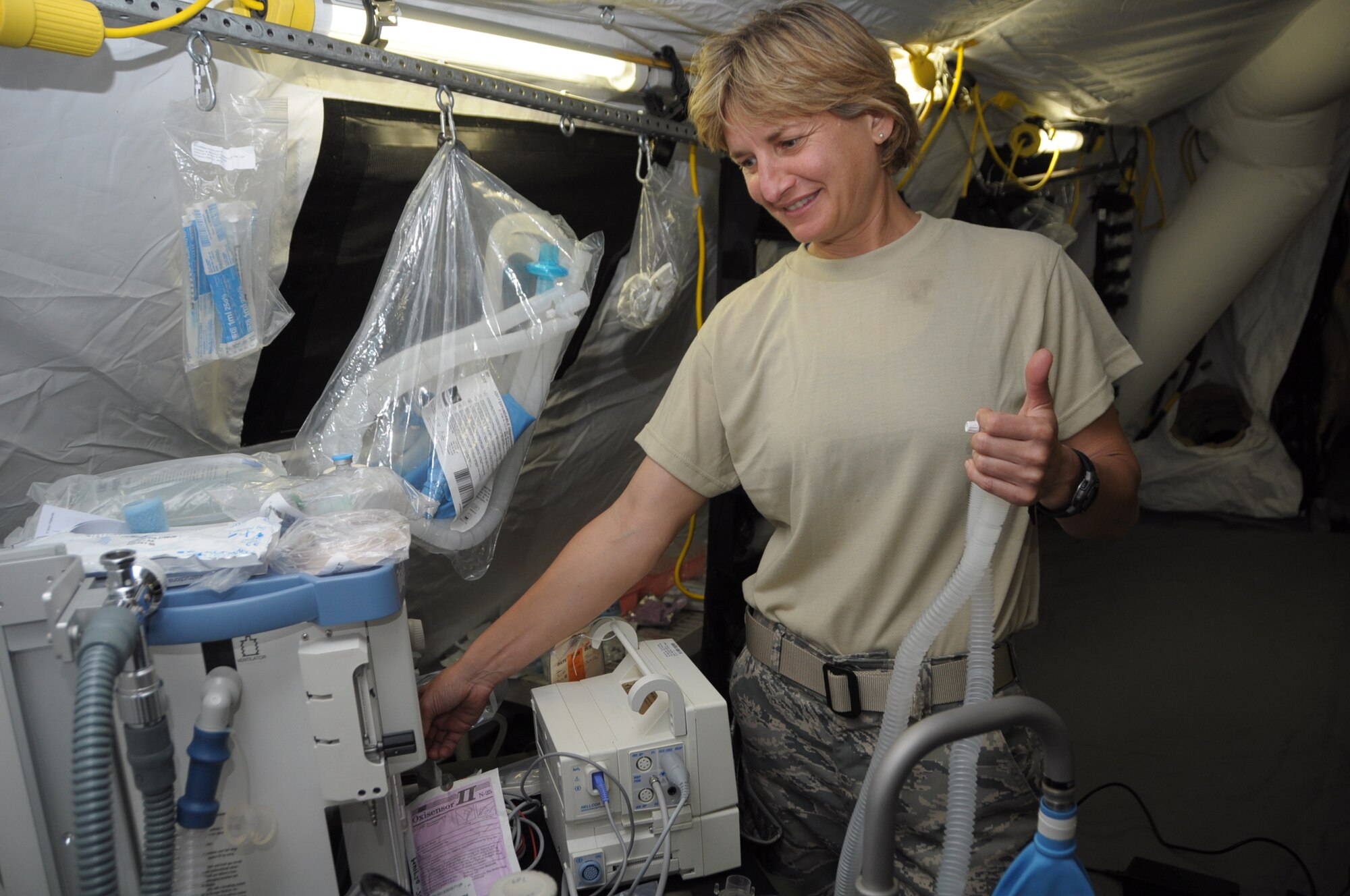 U.S. Air Force Major Bernadette Wisor, 60th Medical Group Anesthesiologist tests her equipment inside the temporary hospital facility in Cumuto Barracks at Trinidad and Tobago April 8, 2011. Wisor is a part of the Expeditionary Medical Support Health Response Team in support of the Allied Forces Humanitarian Exercise/Fuerzas Aliadas or FA HUM 2011. (U.S. Air Force photo by 2d Lt Joel Banjo-Johnson/Released)