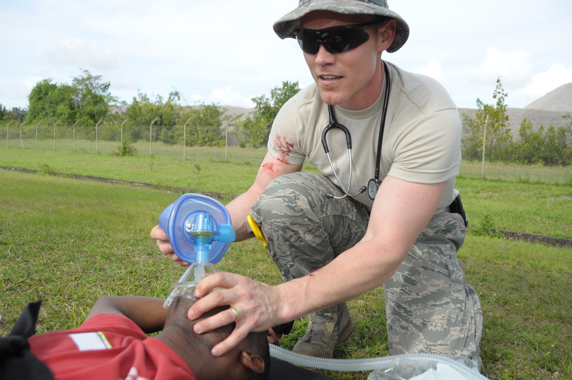 U.S. Air Force Lt Col Jerry Cline, 60th Medical Group Family Medicine Physician gives oxygen to a mock patient in Cumuto Barracks at Trinidad and Tobago April 8, 2011. Cline is a part of the Expeditionary Medical Support Health Response Team in support of the Allied Forces Humanitarian Exercise/Fuerzas Aliadas or FA HUM 2011. (U.S. Air Force photo by 2d Lt Joel Banjo-Johnson/Released)
