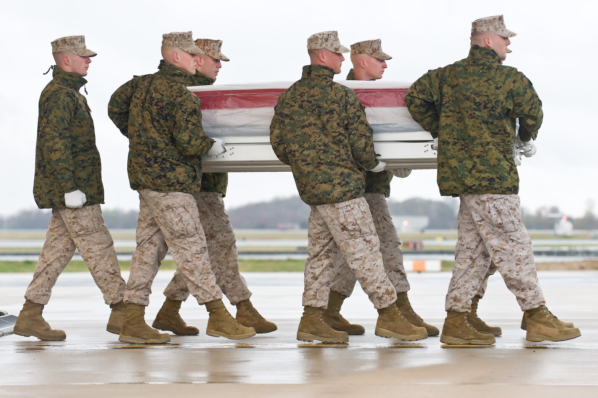 A U.S. Marine Corps carry team transfers the remains of Marine Staff Sgt. Jeremy D. Smith, of Arlington, Texas, at Dover Air Force Base, Del., April 8, 2011. Smith was assigned to the 1st Battalion, 23rd Marine Regiment, 4th Marine Division, Marine Forces Reserve, based out of Houston, Texas. (U.S. Air Force photo/Roland Balik)