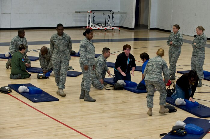 NELLIS AIR FORCE BASE, Nev.-- Participants of the Automated External Defibrillator Rodeo learn how to use an AED April 7. The rodeo is a 30 min. class held at the Nellis fitness center, that teaches participants how to use an AED. The Public Access Defibrillation program set up the AED rodeo so service members and civilians working on base become more aware of the equipments potential to save lives. (U.S. Air Force photo by Airman 1st Class Matthew Lancaster)