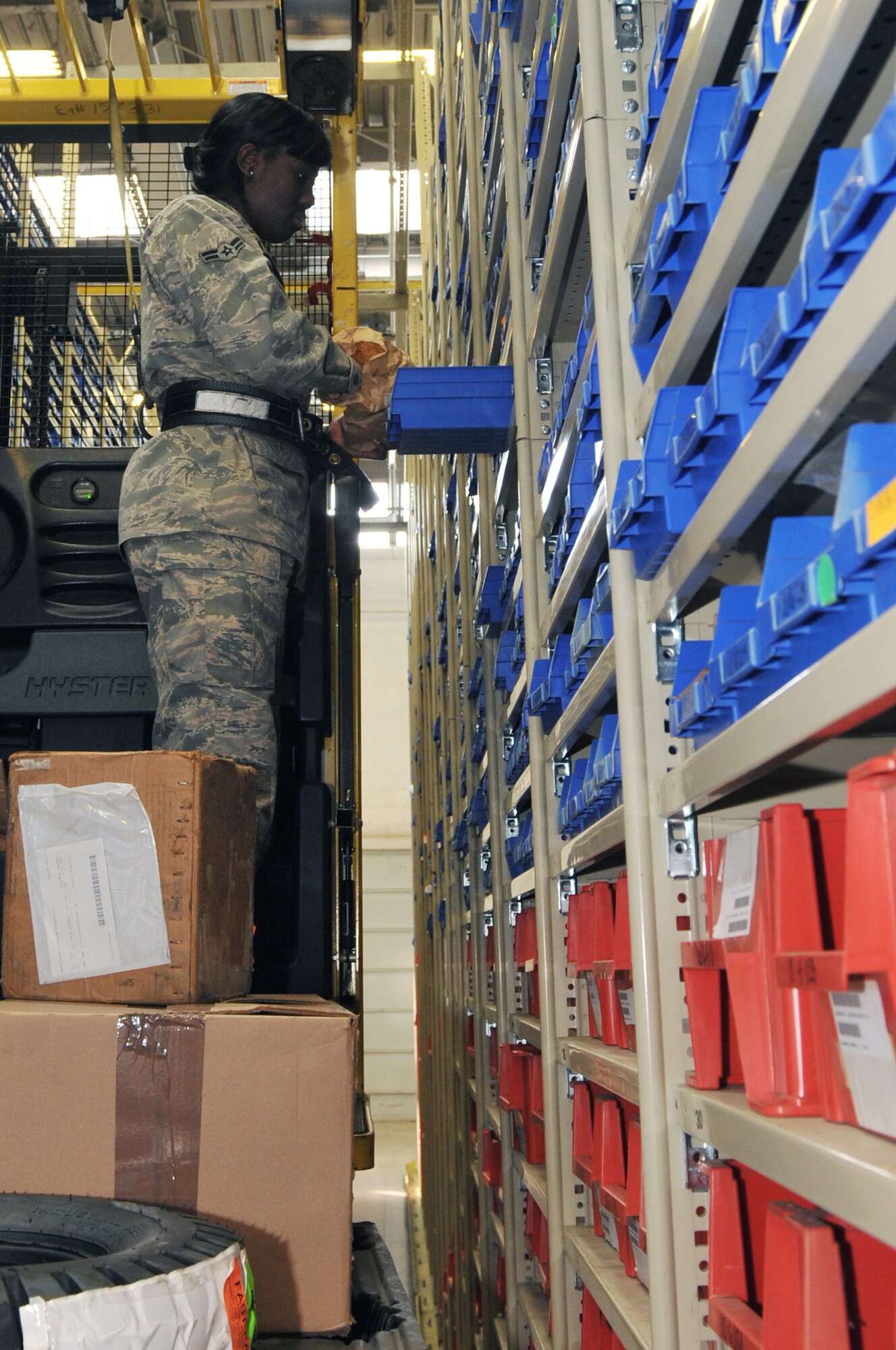 Airman 1st Class Brandi Bell, a 19th Logistics Readiness Squadron central storage specialist, pulls orders for a customer March 31, 2011, at Little Rock Air Force Base, Ark. Central storage staff members receive an average of 300 orders a day. (U.S. Air Force photo by Airman 1st Class Rusty Frank)