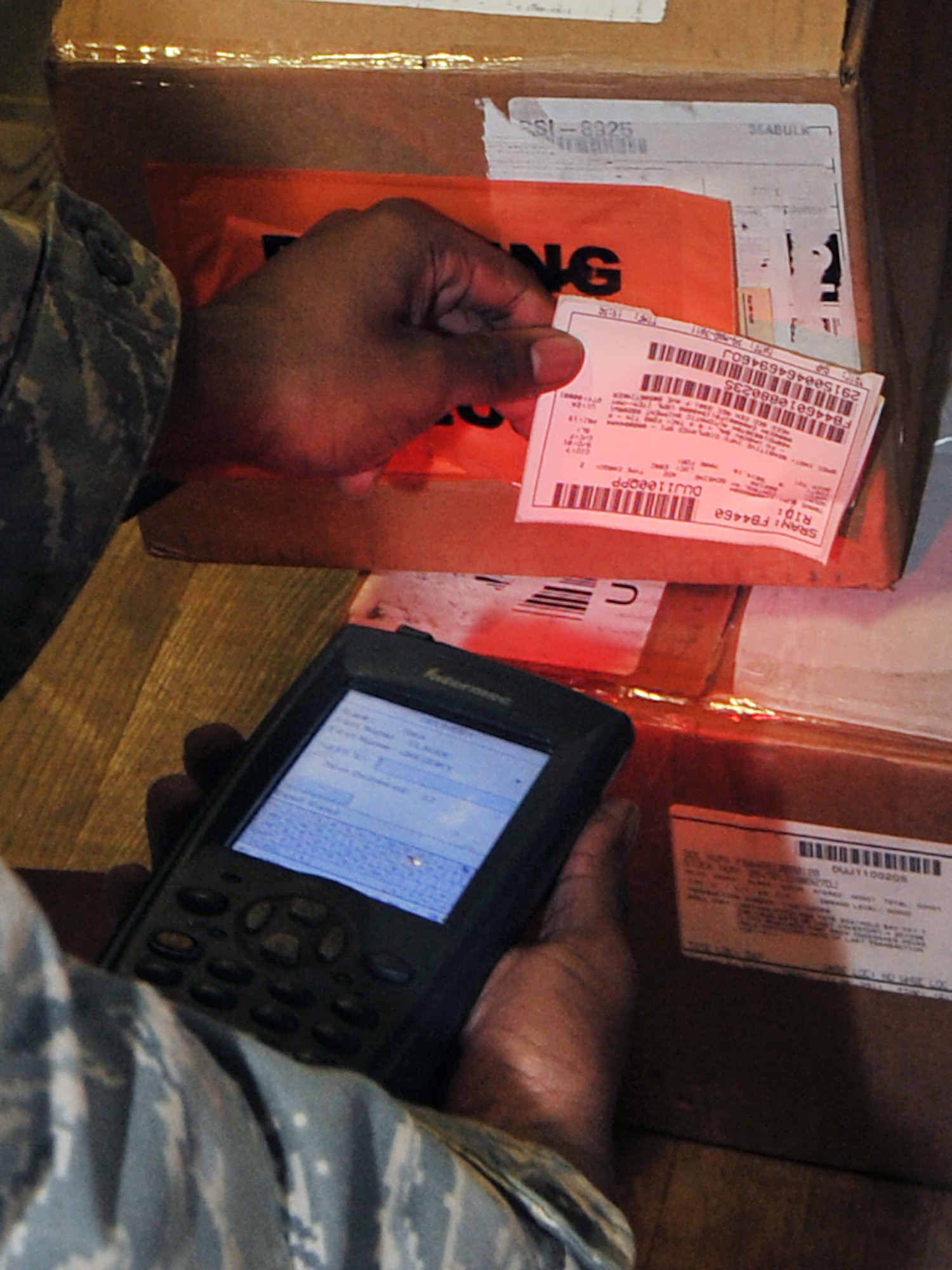 Airman Dvonte Bell, a 19th Logistics Readiness Squadron flight services technician, scans a barcode for an unserviceable part March 31, 2011, at Little Rock Air Force Base, Ark. The flight service center's responsibility is to ensure parts are scanned, inspected and shipped to the right place for maintenance. (U.S. Air Force photo by Airman 1st Class Rusty Frank)