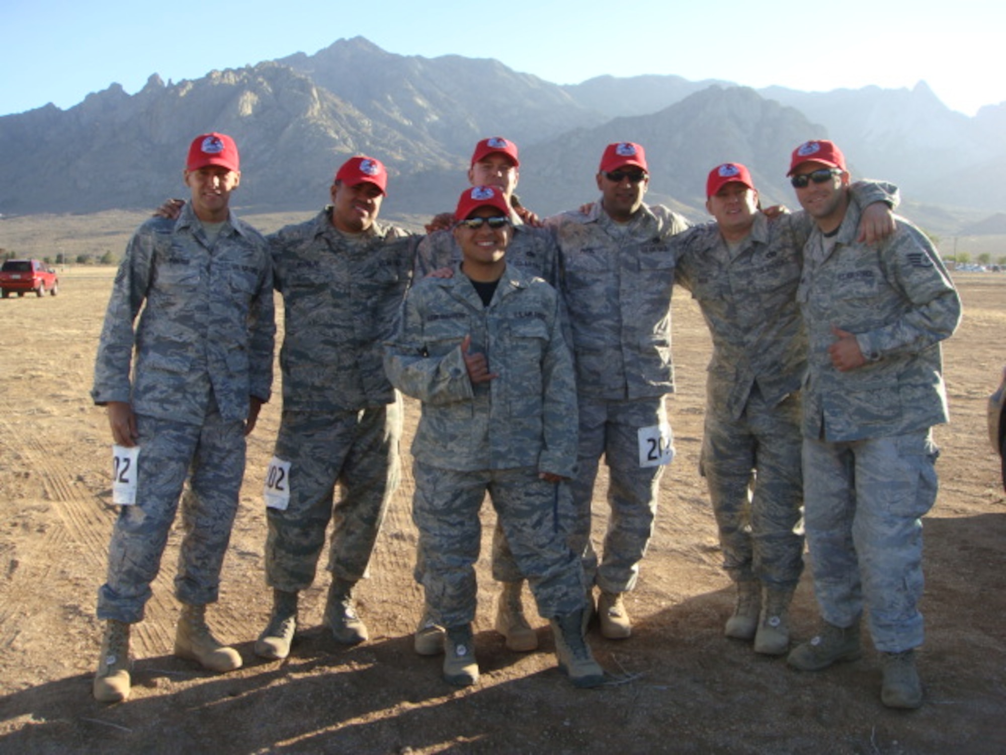 Nellis Airmen from the 820th REDHORSE vehicle maintenance team gather together after completing the 22nd Annual Bataan Memorial Death March, March 27, at White Sands Missile Range.  The event, attended by a record number of more than 6,000 marchers, commemorates the original Bataan Death March which occurred in the Philippines during World War II. (Courtesy photo)