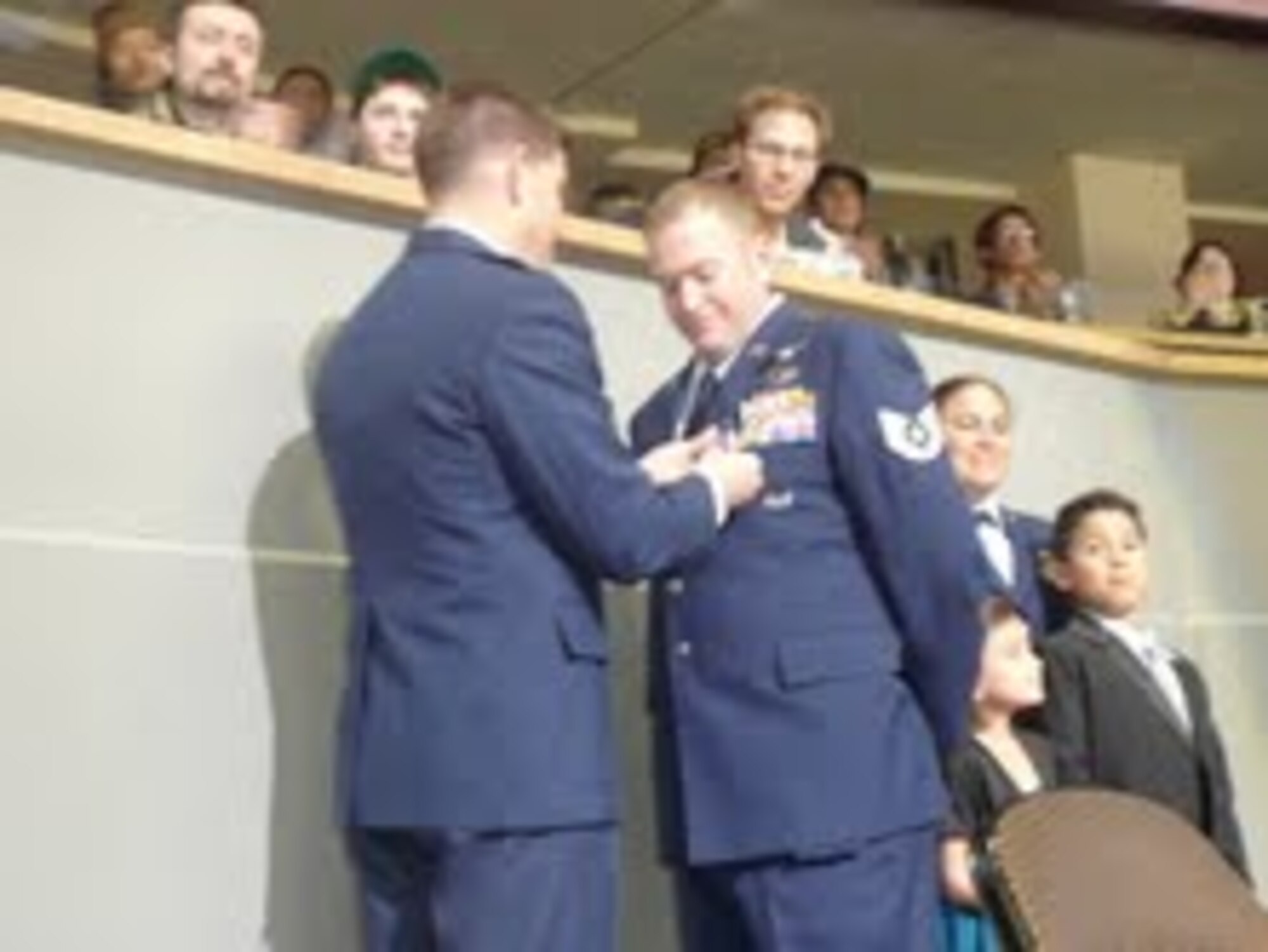 On March 22, Tech. Sgt. David S. Romanowsky received the Purple Heart for his valiant efforts in support of Operation Iraqi Freedom. Lt. Col. David Scanlon, 566th Intelligence Squadron commander, presented the medal to Sergeant Romanowsky during a Colorado Avalanche hockey game.

