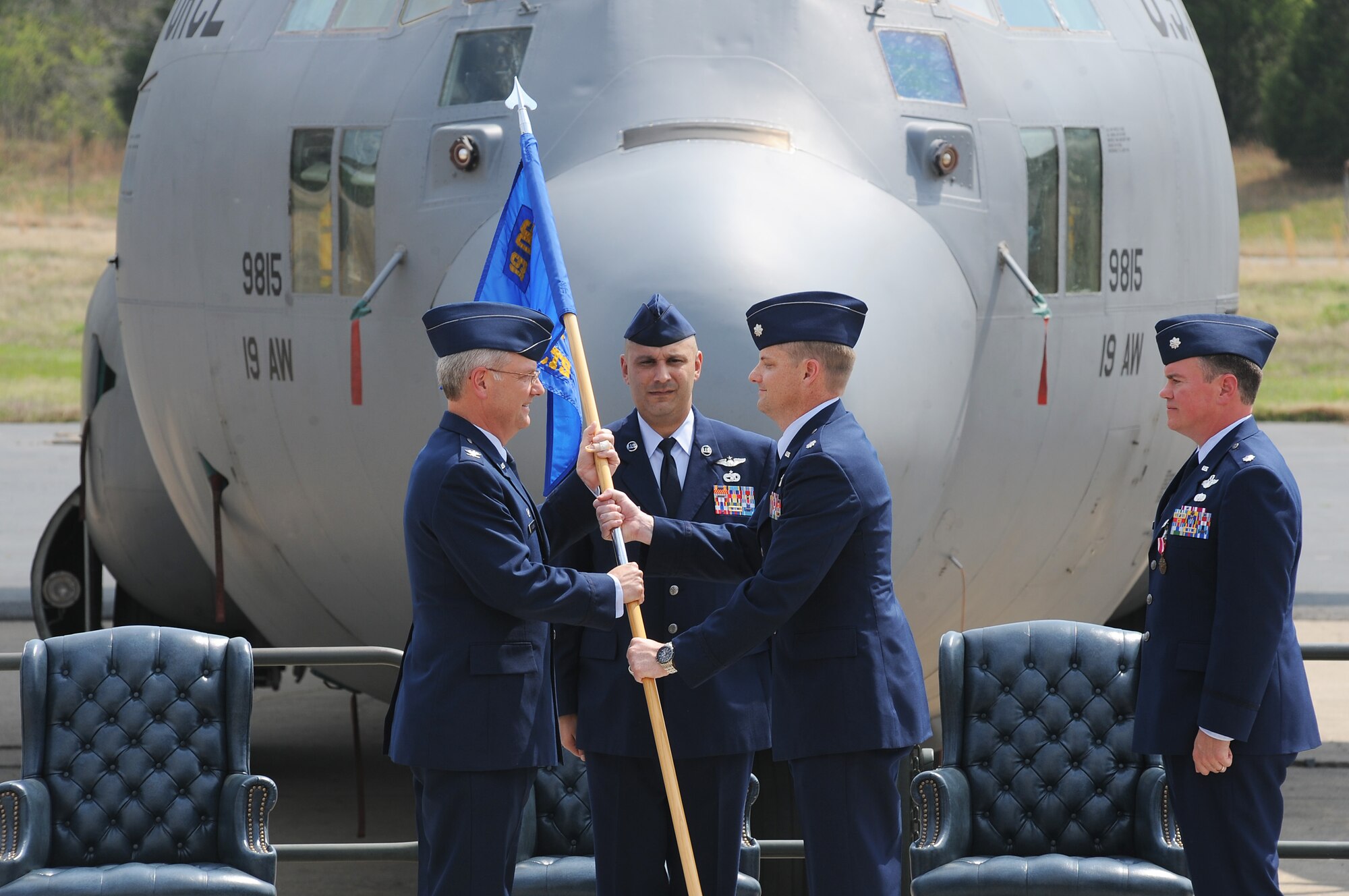 Lt. Col. Andre’ Menard (right) accepts the 34th Combat Training Squadron guidon from Col. David Kasberg, 19th Operations Group commander, and as such, command of the unit April 5, 2011, at Little Rock Air Force Base, Ark.  The 34th CTS commander oversees the planning and execution of Mobility Air Forces participation in 10 Green Flag East joint multi-national, live-fire combat mission rehearsals per year as part of the Joint Readiness Training Center exercise program. (U.S. Air Force photo by Tech. Sgt. Chad Chisholm)