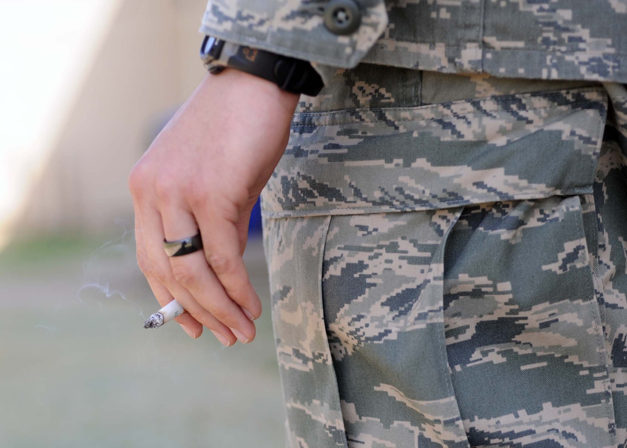 ALTUS AIR FORCE BASE, Okla.--An Airman from the 97th Air Mobility Wing holds a cigarette outside of his place of work. According to the United States Marine Corps National Health Naval Research Center, Tobacco kills as many Americans as in all our wars combined. (U.S. Air Force photo/Senior Airman Leandra D. Stepp)
