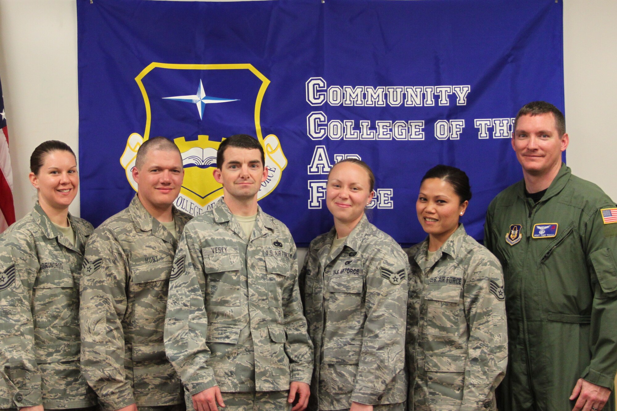 The 310th Space Wing's graduates of the Community College of the Air Force
gathered before the graduation ceremony April 2 at Buckley Air Force Base,
Colo. Airmen who earned their Associates in Applied Science include (from
left to right) Tech. Sgt. Kasey Grinrod, Senior Airman Aaron Hunt, Tech.
Sgt. Eric Vesey, Senior Airman Ashley Powell, Staff Sgt. Kelly Sisavaddy,
and Master Sgt. Anthony Tocco. (U.S. Air Force photo by Staff Sgt. Desiree
Economides)
