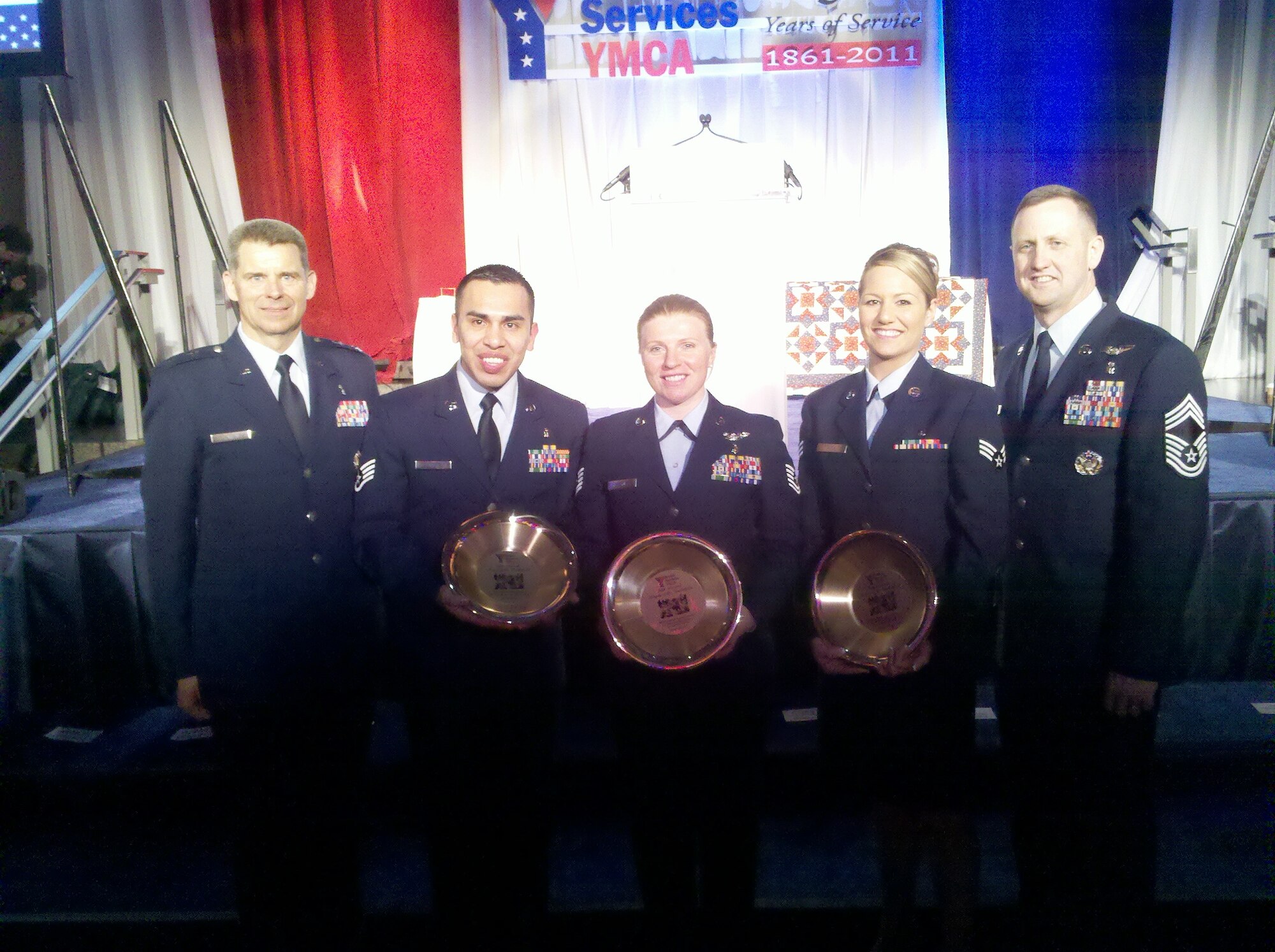 The Air Force Medical Service's Total Force was represented by five key
members at the Armed Services YMCA's 5th Annual Angels of the Battlefield
Gala at the Ronald Reagan Building and International Trade Center in
Washington March 31.  From left:  Maj. Gen. (Dr.) Gerard A. Caron, 79th
Medical Wing commander, Andrews Air Force Base, Md.; Staff Sgt. Abraham
Jara, 79th Medical Group at Joint Base Anacostia-Bolling in Washington
(Active Duty); Tech. Sgt. Christina Wiskowski, 514th Aeromedical Evacuation
Squadron at Joint Base McGuire-Dix-Lakehurst, N.J., (Reserve); Senior Airman
Candice Cook, 171st Air Refueling Wing Medical Group at Coraopolis, Pa.,
(Guard: and Chief Master Sgt. Charlie Cole, AFMS Chief, Medical Enlisted
Force.  General Caron is also Assistant AF Surgeon General for Dental
Services.  (USAF Photo)
