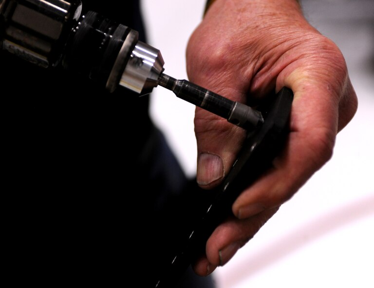 MOODY AIR FORCE BASE, Ga.-- A deburring tool is used to remove burrs from components of the loadmaster’s crashworthy seat April 7. The new seat will provide a safer and more structurally sound seat for loadmasters during flight. (U.S. Air Force photo/Airman 1st Class Benjamin Wiseman)(RELEASED)