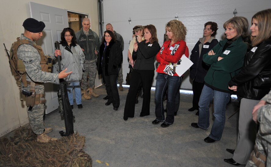 The second leg of the tour included a demonstration by the 341st Security Forces Group’s Tactical Response Force. Here, Airman Andre Davis explains the Barrett .50 caliber long range sniper rifle to them.  (U.S. Air Force photo/Beau Wade)