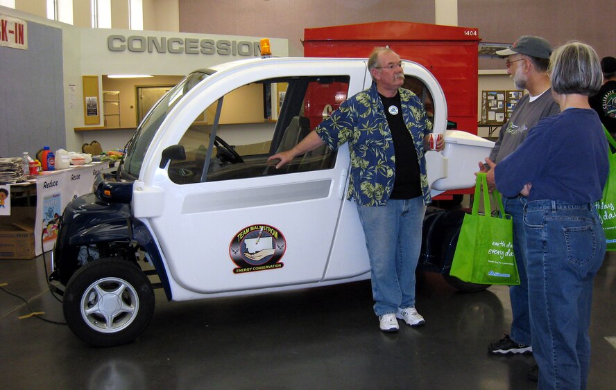 Frank Carpenter chats with community members about the electric car from Malmstrom that was on display at the Civic Center last year as part of the annual Earth Day celebration. Mr. Carpenter is an environmental protection specialist with the 341st Civil Engineer Squadron. (U.S. Air Force Courtesy photo)