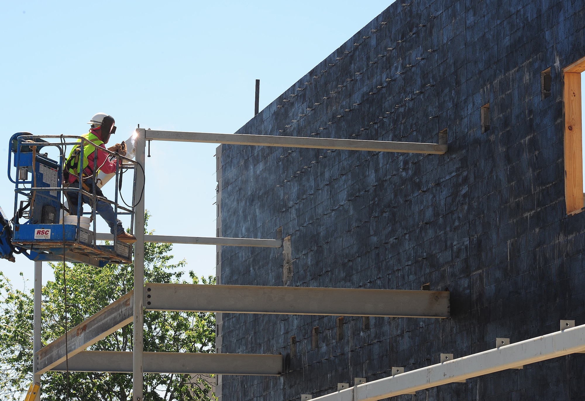 MOODY AIR FORCE BASE, Ga.-- A construction worker welds two pieces of metal rails together April 7. The commissary is being expanded to give Airmen and their families a larger place to shop with more options. (U.S. Air Force photo/Senior Airman Stephanie Mancha)(RELEASED)