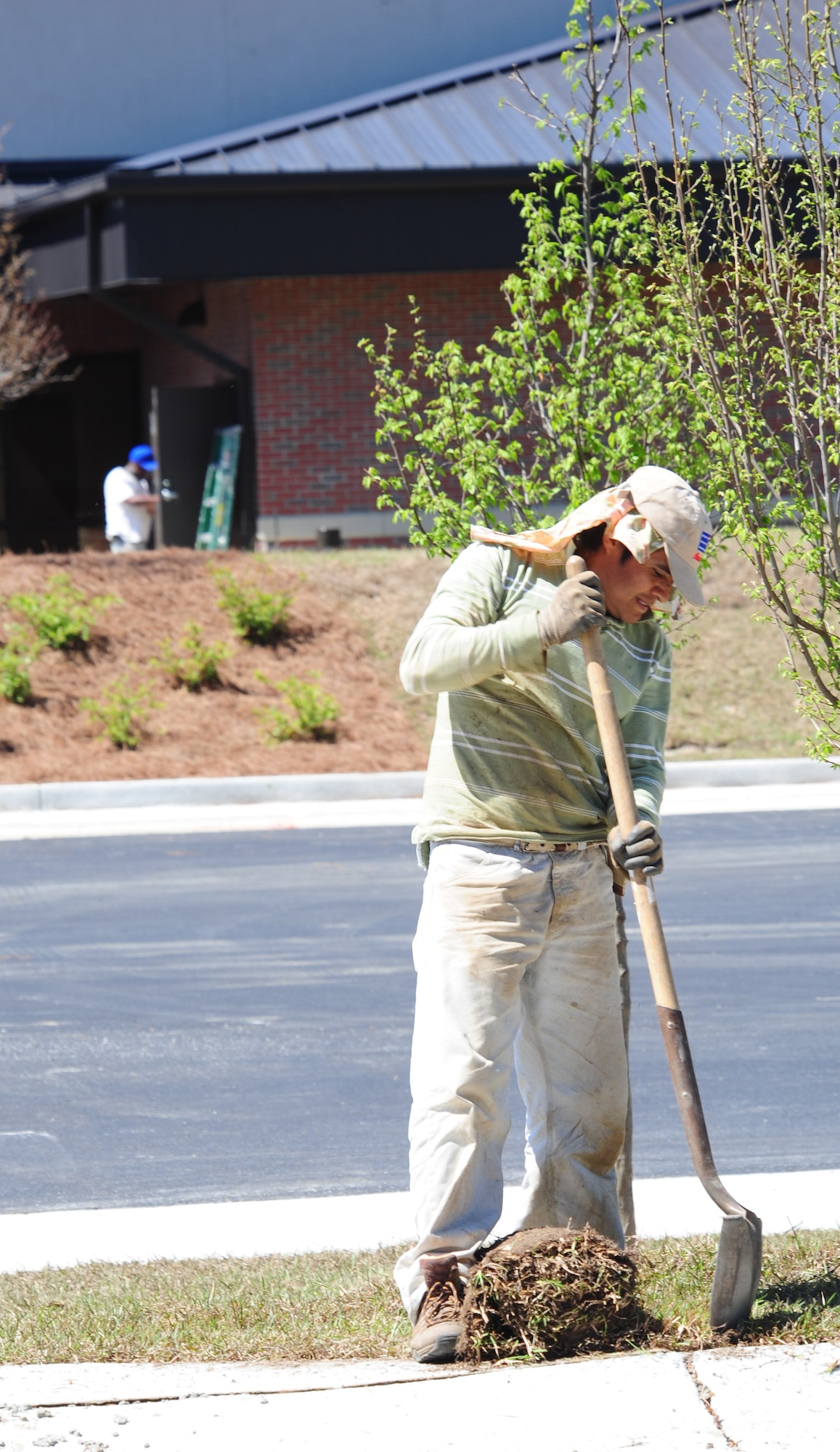 MOODY AIR FORCE BASE, Ga.-- A contractor lays sod onto the lawn of the new Child Development Center April 7. The new CDC is scheduled to be completed in the summer and will be Leadership in Energy and Environmental Design- silver certified. (U.S. Air Force photo/Senior Airman Stephanie Mancha)(RELEASED)