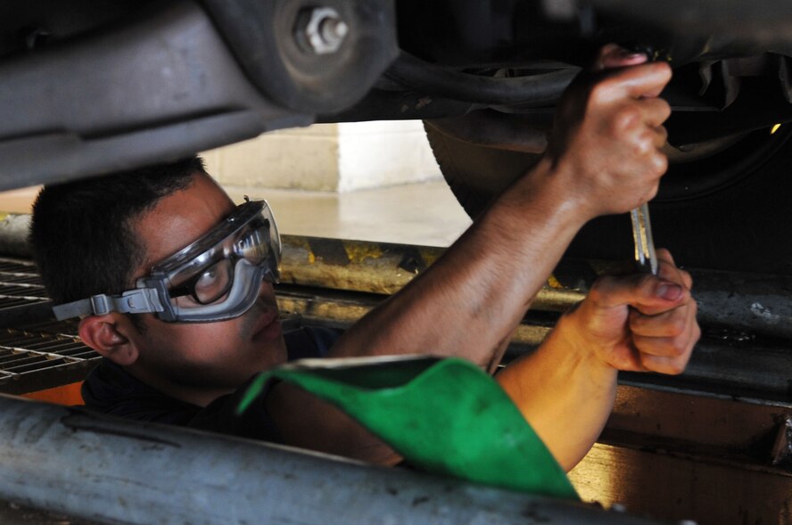 Airman 1st Class Lloyd Bartolome, 2nd Logistics Readiness Squadron vehicle maintenance technician, performs an oil change on a vehicle at Barksdale Air Force Base, La., April 7. The 2 LRS provides a variety of support across the base. Vehicle support consists of aircrew buses and a U-Drive-It fleet, as well as the maintenance of a $46 million vehicle fleet. (U.S. Air Force photo/Senior Airman Brittany Y. Bateman)(RELEASED)