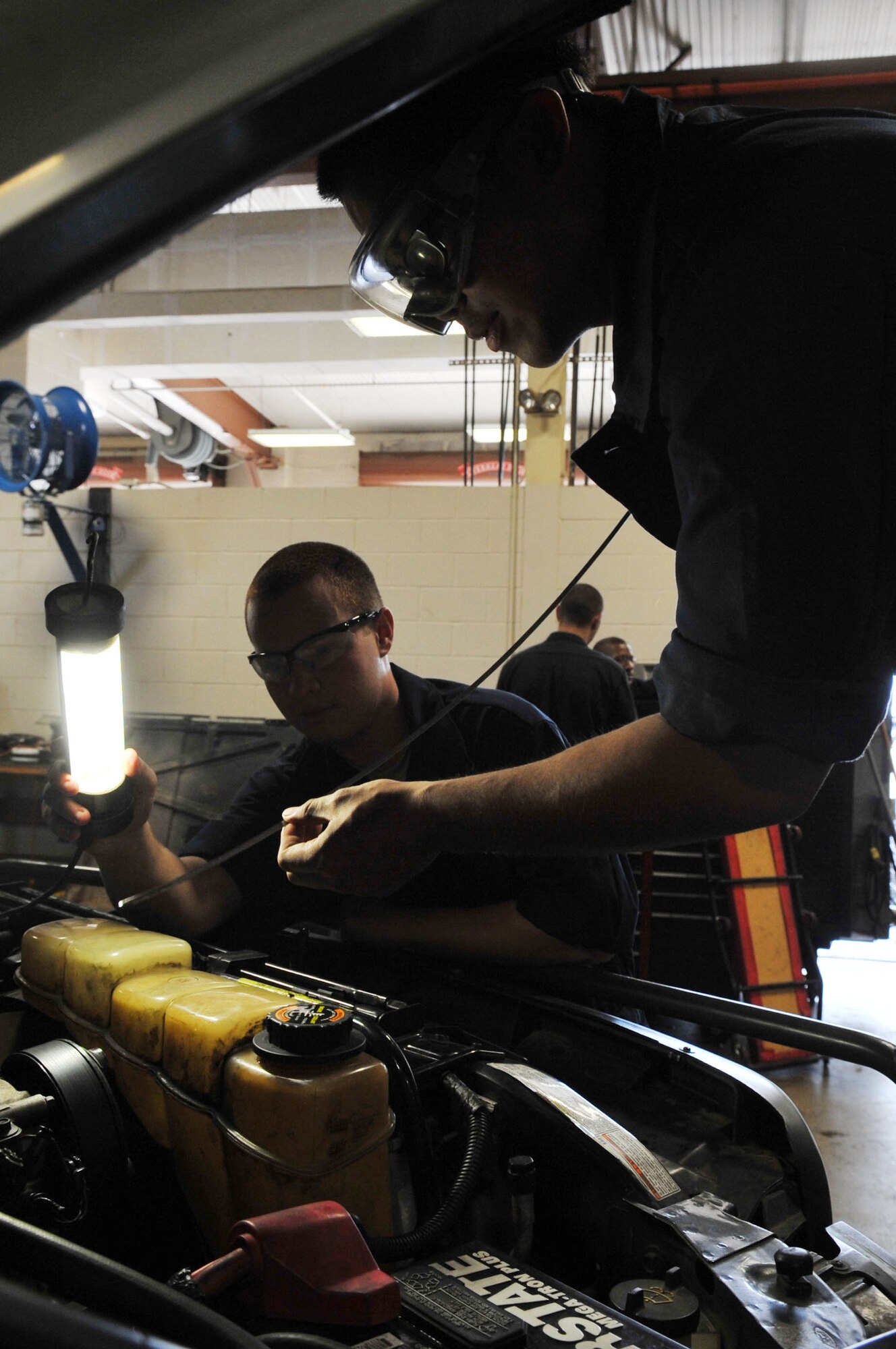 Airman 1st Class Lloyd Bartolome, 2nd Logistics Readiness Squadron vehicle maintenance technician, checks the oil level on a vehicle at Barksdale Air Force Base, La., April 7. The 2 LRS provides for movement of personnel and their household goods as well as shipment of all cargo. They are responsible for all Barksdale deployment functions, including cargo, mobility and ready-team training. (U.S. Air Force photo/Senior Airman Brittany Y. Bateman)(RELEASED)