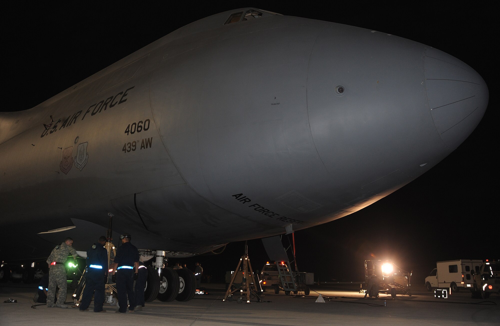 Deployed Airmen perform an operational check after replacing the main landing gear on a C-5 Galaxy on the flightline of this desert air base, April 7.  (U.S. Air Force photo/Staff Sgt. Liliana Moreno)                        