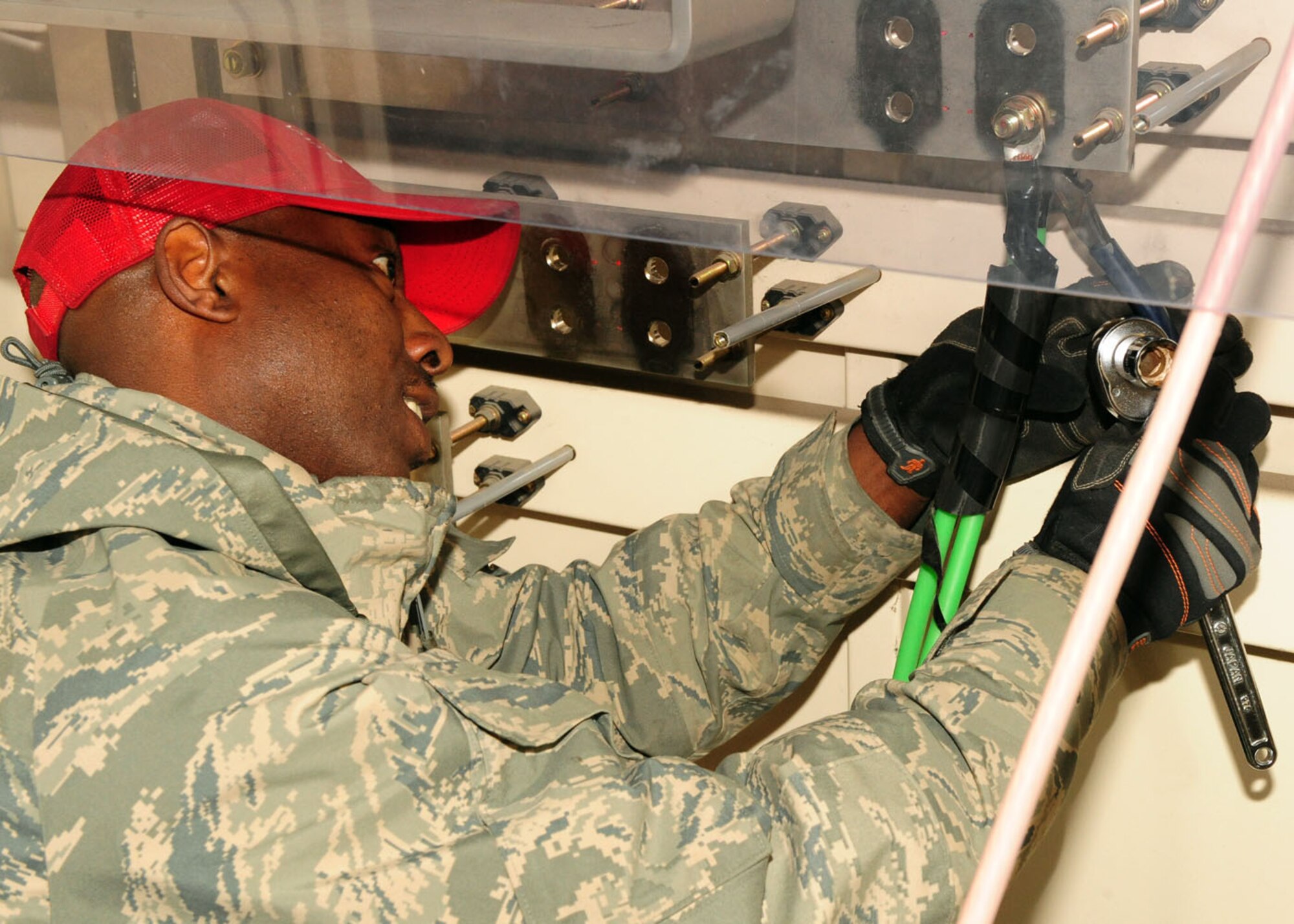 MISAWA AIR BASE, Japan-- Tech. Sgt. Fheoshamin Marshall from Detachment 1-554 Red Horse Squadron, disconnects power cords to a generator April 8. The base lost power after experiencing a 7.1 magnitude aftershock on April 7, requiring the use of generators to keep facilities operational. Airmen from the 35th Civil Engineer Squadron here and Red Horse Squadron from Kadena Air Base, Japan are working together to restore power to the base. (U.S. Air Force photo/ Senior Airman Chelsea Cummings)