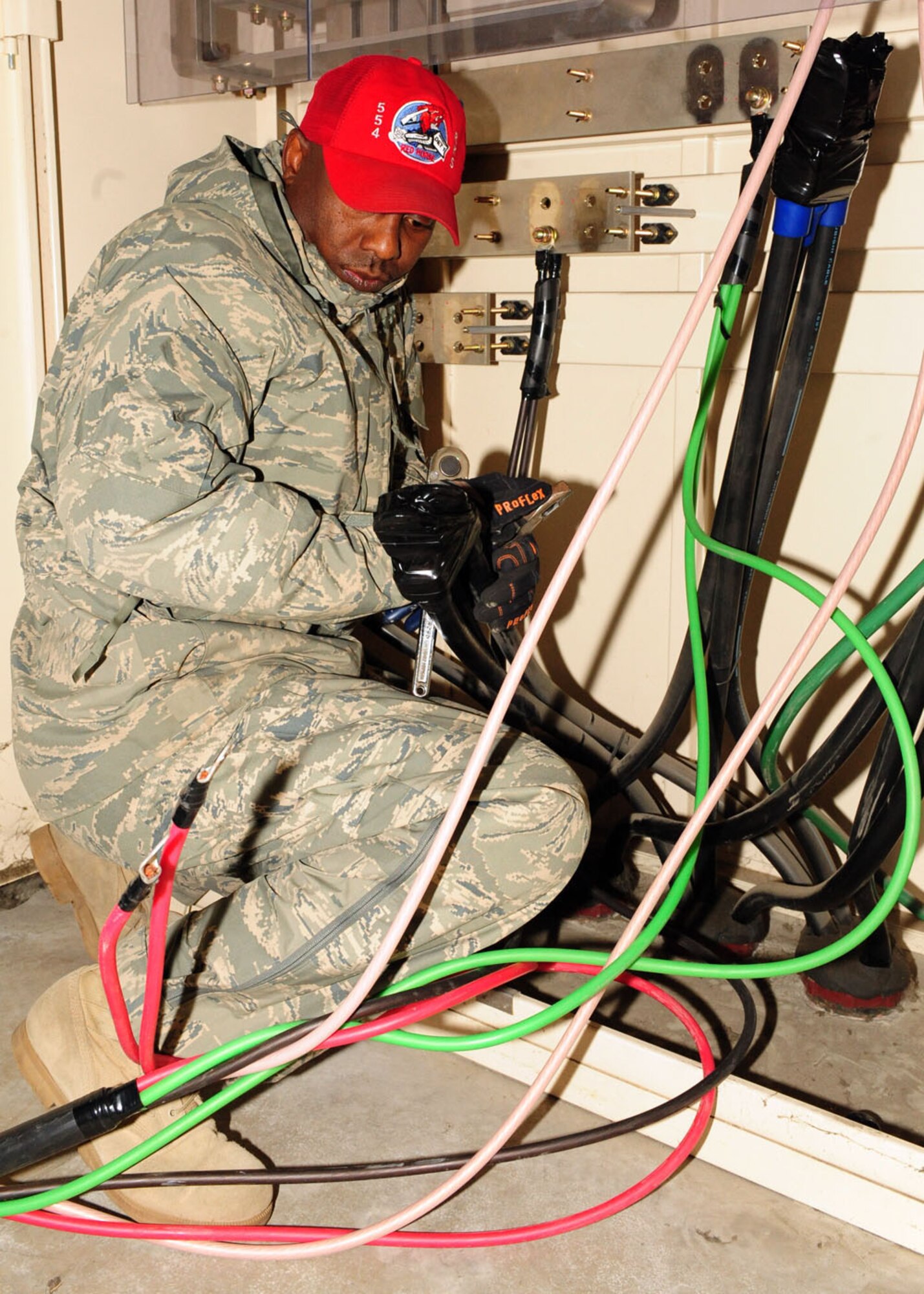 MISAWA AIR BASE, Japan-- Tech. Sgt. Fheoshamin Marshall from Detachment 1-554 Red Horse Squadron, disconnects power cords to a generator April 8. The base lost power after experiencing a 7.1 magnitude aftershock on April 7, requiring the use of generators to keep facilities operational. Airmen from the 35th Civil Engineer Squadron here and Red Horse Squadron from Kadena Air Base, Japan are working together to restore power to the base. (U.S. Air Force photo/ Senior Airman Chelsea Cummings)