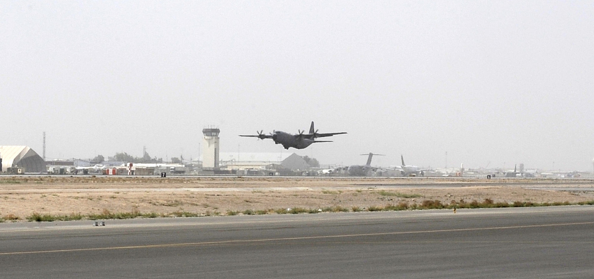 A C-130J Hercules lifts off the runway for an airdrop mission April 8, 2011, at Kandahar Airfield, Afghanistan. The 772nd Expeditionary Airlift Squadron set a record number of airdrops during the month of March with 72 airdrops of more than 1.5 million pounds of supplies for ground troops across Afghanistan. (U.S. Air Force photo/Senior Airman Willard E. Grande II)