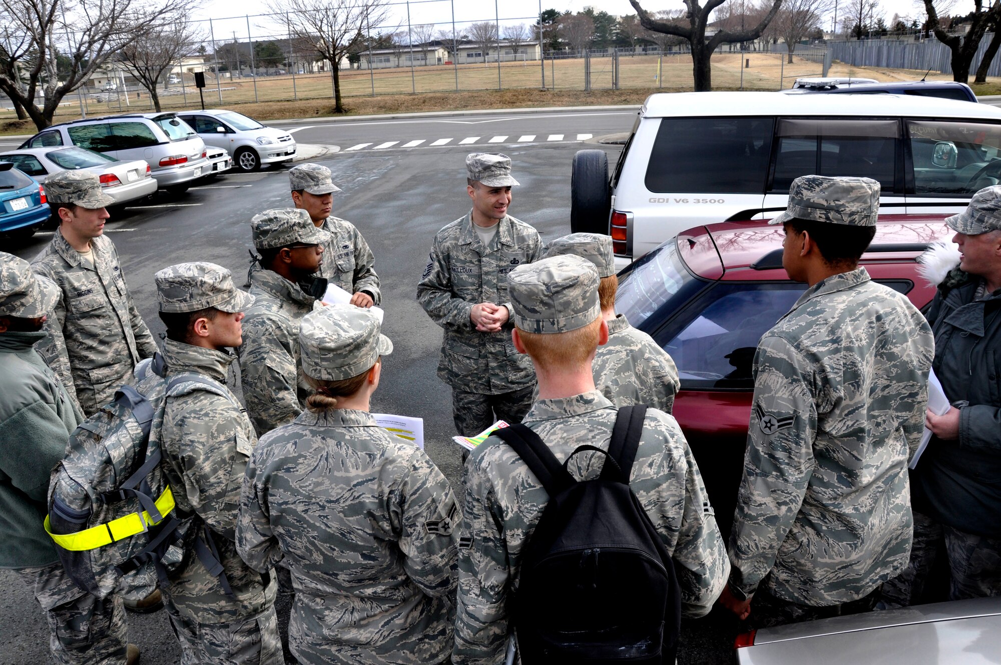 MISAWA AIR BASE, Japan--  Master Sgt. Brian Mailloux, 35th Comptroller Squadron, speaks to a group of Airmen outside the base command post here April 8. The Airmen volunteered to distribute information on base concerning Misawa Air Base's efforts to conserve energy and electricity in the aftermath of the 7.1-magnitude aftershock in Japan April 7. (U.S. Air Force photo by Senior Airman Joe W. McFadden/RELEASED)