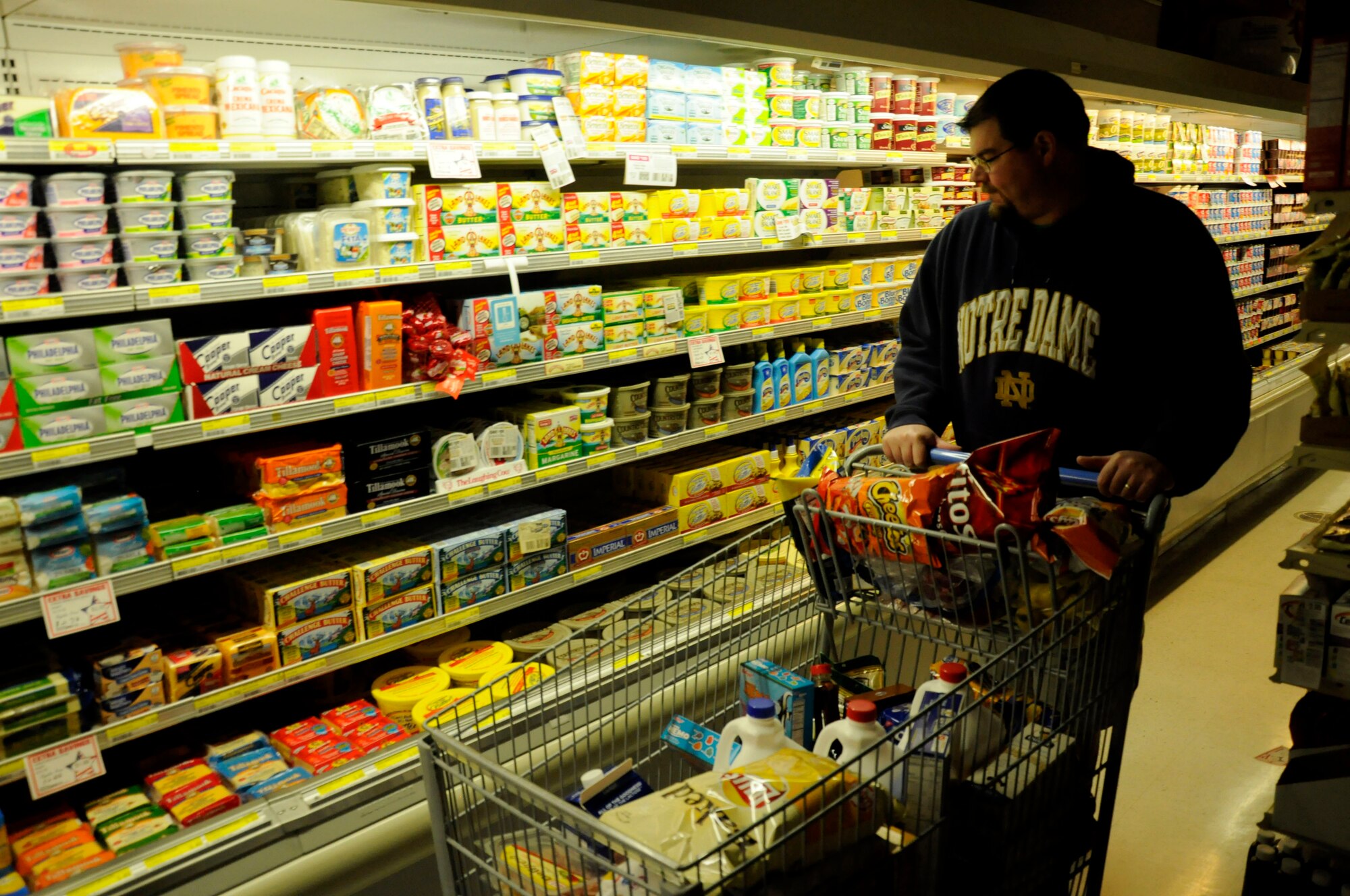 MISAWA AIR BASE, Japan -- Dathan Garcia, husband of Maj. Tricia Garcia, 35th Medical Operations Squadron, shops at the base commissary here April 8. Misawa Air Base leadership is still advising base residents to conserve energy and electricity in the aftermath of the 7.1-magnitude aftershock in Japan April 7. (U.S. Air Force photo by Senior Airman Joe W. McFadden/RELEASED)