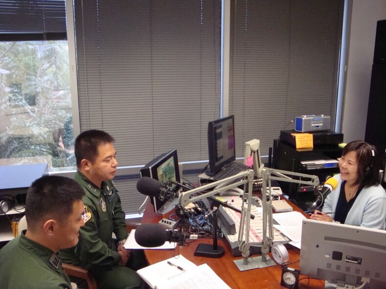 Lt. Col. Mamoru Uegaki and Lt. Col. Shinya Kitamura, Japan Air Self Defense Force liaison officers, discuss "Operation Tomodachi" with Ms. Kaoru Ekimoto, radio DJ for KZOO Japanese radio station at Honolulu, Hawaii. The colonels are part of the planning and implementation of the U.S. military's humanitarian support to the government of Japan and Japan military forces during the aftermath of the earthquake and tsunami in the Sendai region. Colonel Uegaki is assigned to 13th Air Force Air Operations Center and Colonel Kitamura is assigned to Headquarters Pacific Air Forces International Affairs division. (Courtesy photo)   
