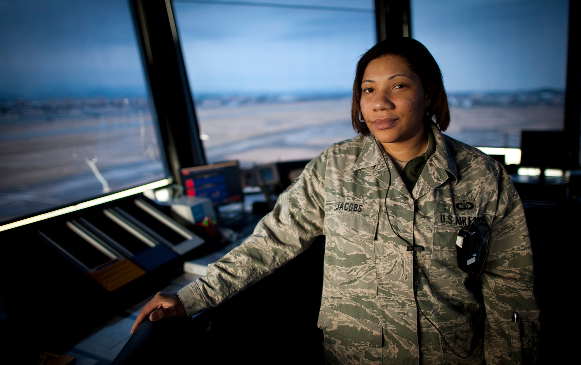 YOKOTA AIR BASE, Japan -- Tech. Sgt. Natalie Jacobs, 374th Operations Support Squadron air traffic control watch supervisor, stands in the control tower at Yokota Air Base, Japan, April 3, 2011. "I'm doing the same job as I was before Operation Tomodachi, but it feels good that I'm helping get supplies to those who need them," said Sergeant Jacobs. "It gives me a sense of purpose knowing I'm helping people." Sergeant Jacobs hails from Chicago. (U.S. Air Force photo/Staff Sgt. Samuel Morse)
