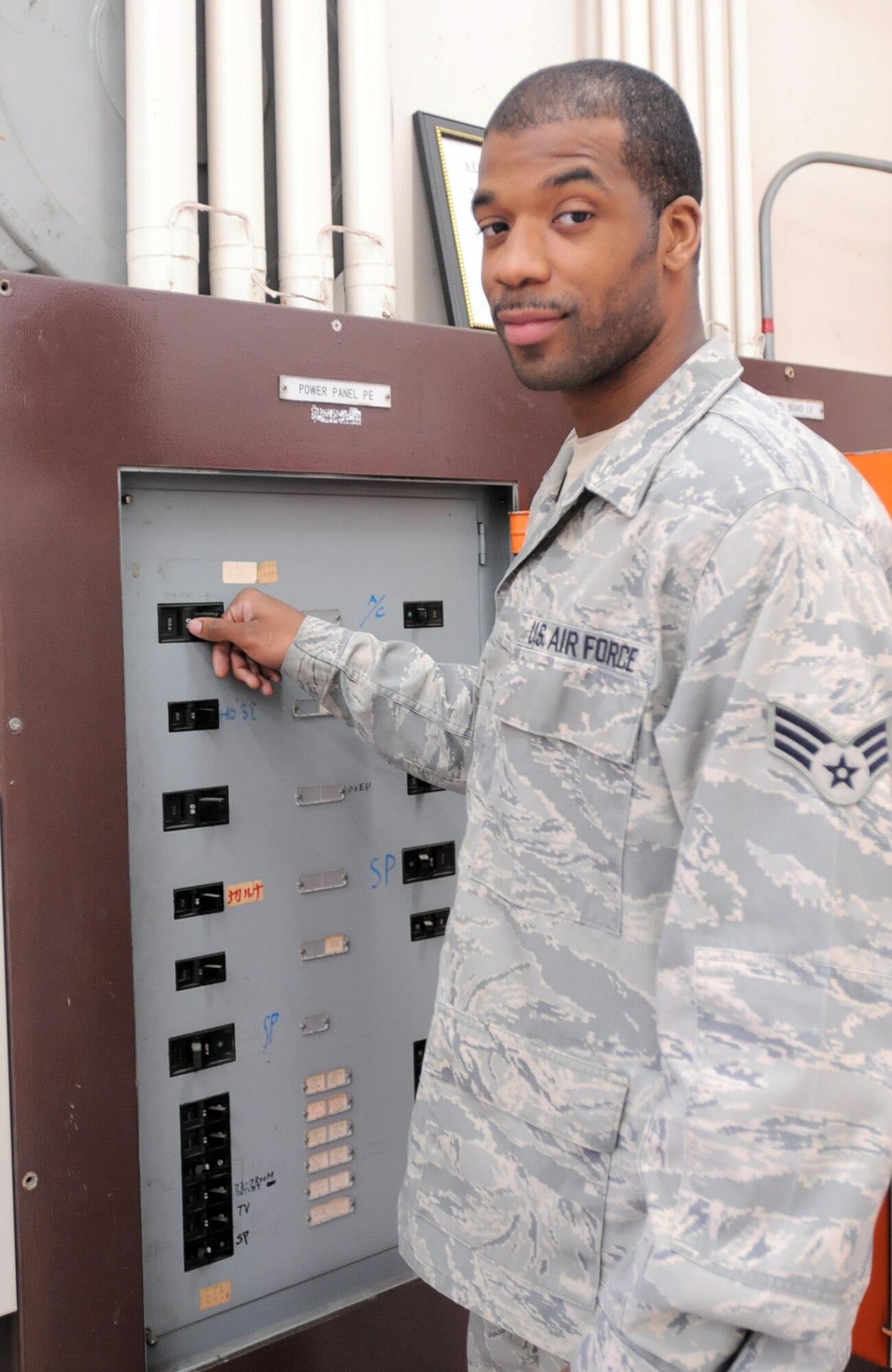 YOKOTA AIR BASE, Japan -- Senior Airman Kyshown D. Campbell, an electrician with the 374th Civil Engineer Squadron, operates electrical equipment at Yokota Air Base, Japan, April 8, 2011. Airman Campbell is a native of Sacramento, Calif., and said his experience while deployed to Iraq helped prepare him to support Operation Tomodachi. (U.S. Air Force photo/Airman 1st Class Krystal M. Garrett)
