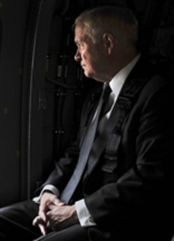 Secretary of Defense Robert M. Gates is transported by an Army UH-60 Blackhawk helicopter during a trip to Baghdad, Iraq, on April 8, 2011.  Gates met with U.S. and Iraqi leaders, troops and held discussions while taking photos and giving out coins to deployed members.  