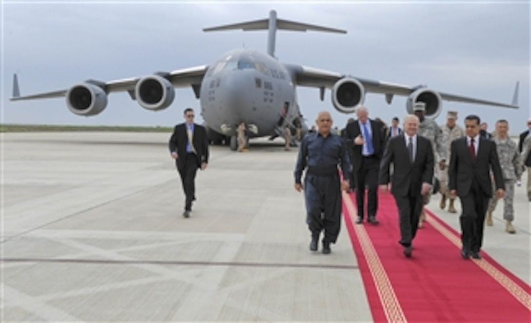 Secretary of Defense Robert M. Gates arrives in Irbil, Iraq, by an Air Force C-17 Globemaster III aircraft during a trip to Baghdad, Iraq, on April 8, 2011.  Gates met with U.S. and Iraqi leaders, troops and held discussions while taking photos and giving out coins to deployed members.  DoD photo by Master Sgt. Jerry Morrison, U.S. Air Force.  (Released)