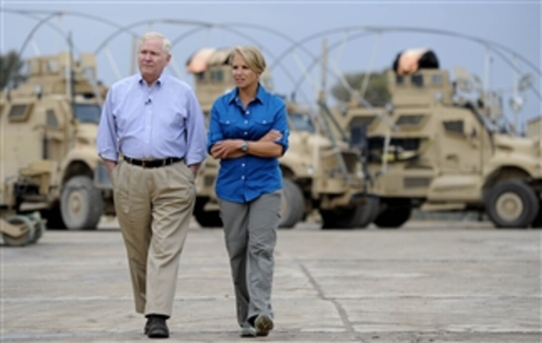 Secretary of Defense Robert M. Gates talks with 60 Minutes anchor Katie Couric during an interview for her show in Mosul, Iraq, on April 8, 2011.  Gates met with U.S. and Iraqi leaders, troops and held discussions while taking photos and giving out coins to deployed members during his stay in Iraq.  