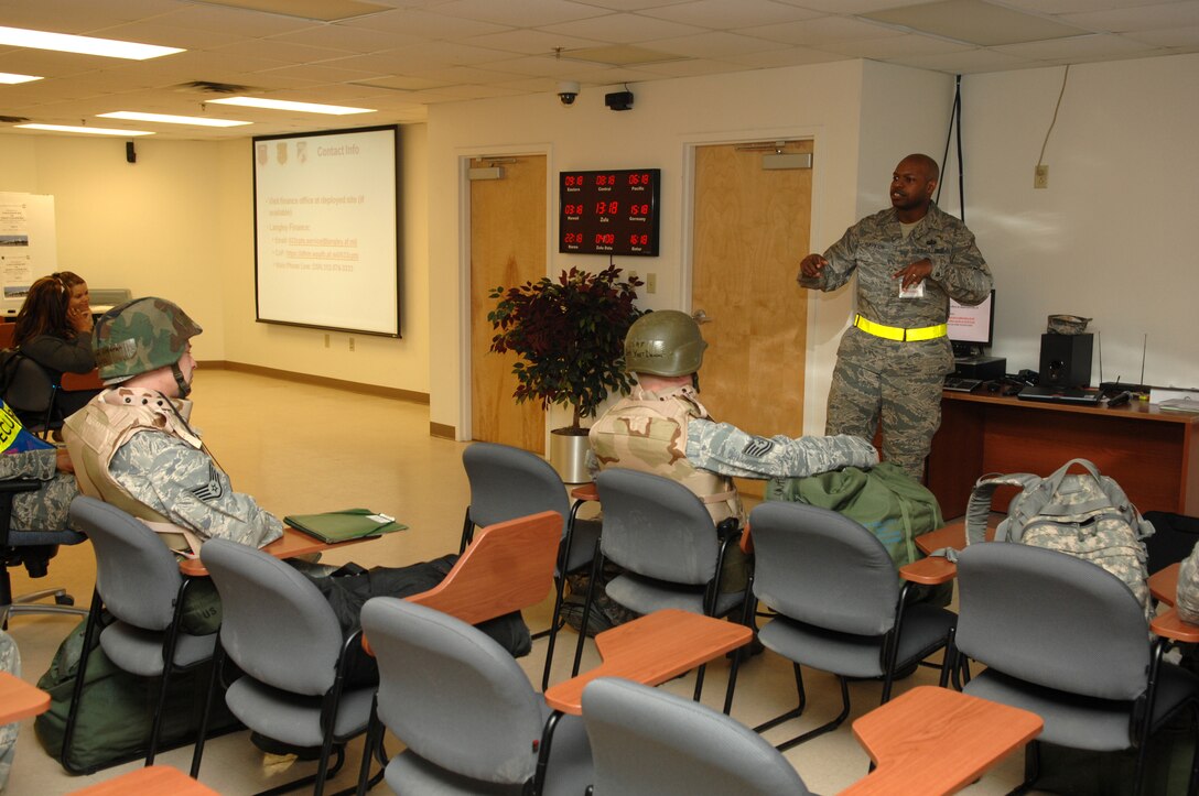 Staff Sgt. Lawrence Robinson, 633d Comptroller Squadron finance customer service supervisor, briefs deploying members on various pay entitlements while members are deployed during an Operational Readiness Inspection April 8, 2011 at Langley Air Force Base, Va. Joint Base Langley-Eustis is the first joint base to be inspected on deployment operational procedures and this is the first time the functions of an F-22 Raptor will be put to the test during an ORI. (U.S. Air Force photo by Staff Sgt. Jeff Nevison/Released)

