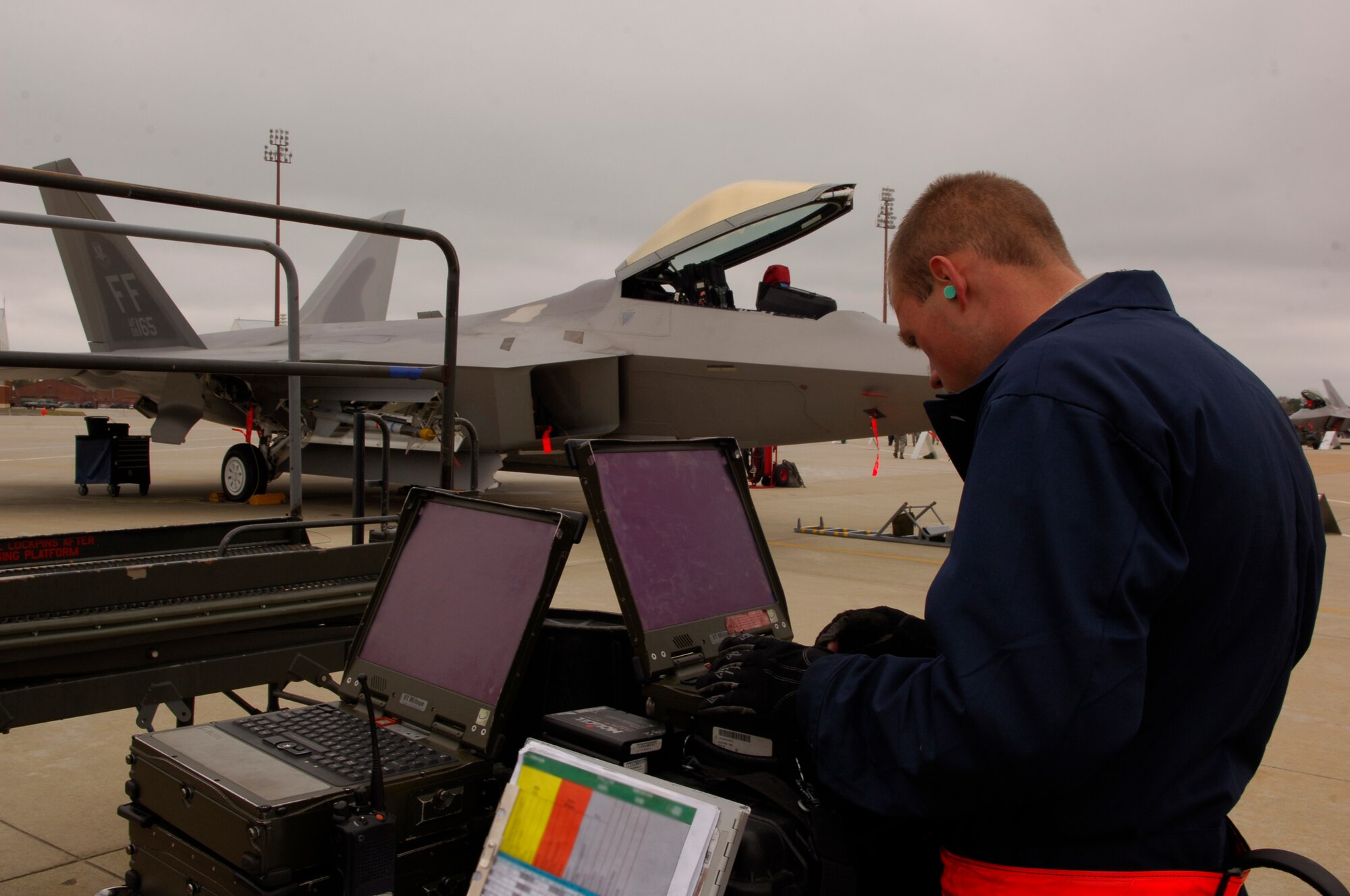 Airman 1st Class James Haubrich, 27th Maintenance Squadron crew chief, tracks F-22 maintenance during an Operational Readiness Inspection at Langley Air Force Base, Va., April 9, 2011. The inspection evaluates an installation's ability to efficiently deploy military members and rapidly adjust to changing security conditions. (U.S. Air Force photo by Airman 1st Class Camilla Elizeu/Released)  
