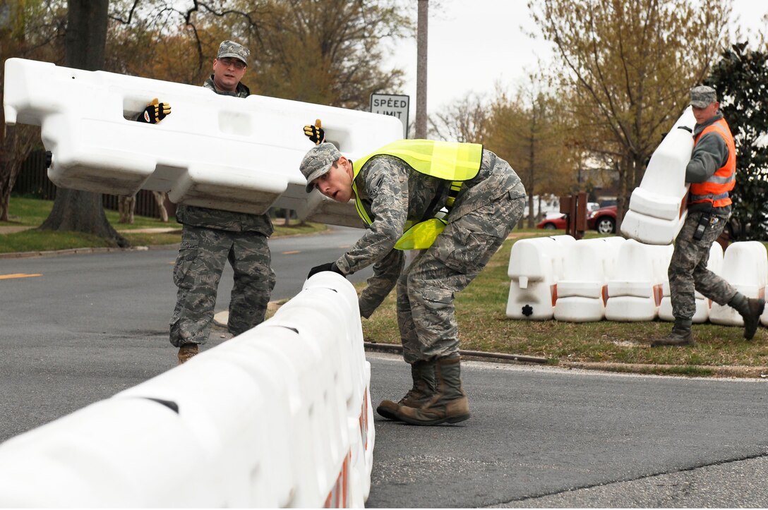 633d Civil Engineer Squadron personnel implement security measures during an Operational Readiness Inspection at Langley Air Force Base, Va., April 9, 2011. The ORI is designed to evaluate the rapid deployment capability of installation personnel, cargo, and equipment. (U.S. Air Force photo by Airman 1st Class Kayla Newman/Released)
