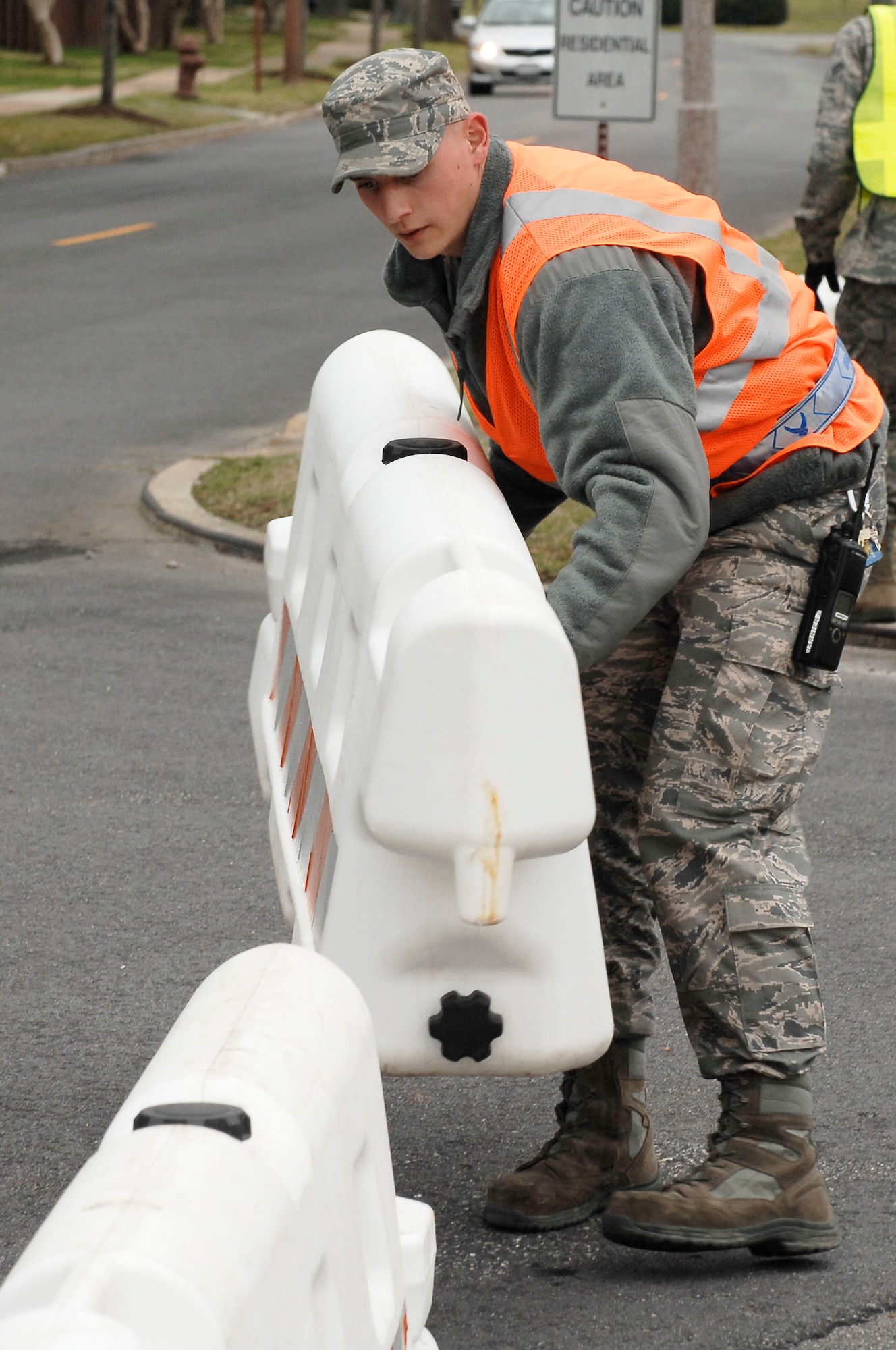 Airman 1st Class Matt Cauldelo, 633d Civil Engineer Squadron power production technician, implements security measures during an Operational Readiness Inspection at Langley Air Force Base, Va., April 9, 2011. The ORI is designed to evaluate the rapid deployment capability of installation personnel, cargo, and equipment. (U.S. Air Force photo by Airman 1st Class Kayla Newman/Released)