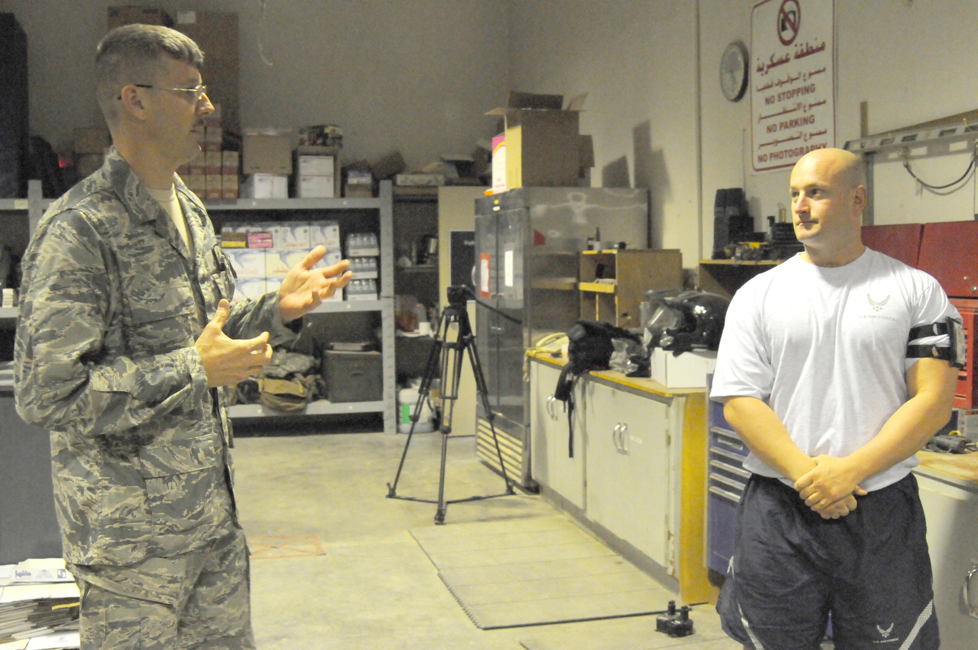 Master Sgt. Edward Nickel, explosive ordnance disposal flight chief with the 386th Expeditionary Civil Engineer Squadron, left, answers questions about EOD posed by Staff Sgt. Benjamin Cully, a firefighter also with the 386th ECES. Sergeant Cully shadowed Sergeant Nickel as part of the Rock Top III Shadow Program, which allows enlisted members to shadow senior non-commisioned officers in other career fields. (U.S. Air Force photo by Staff Sgt. Patrice Clarke)