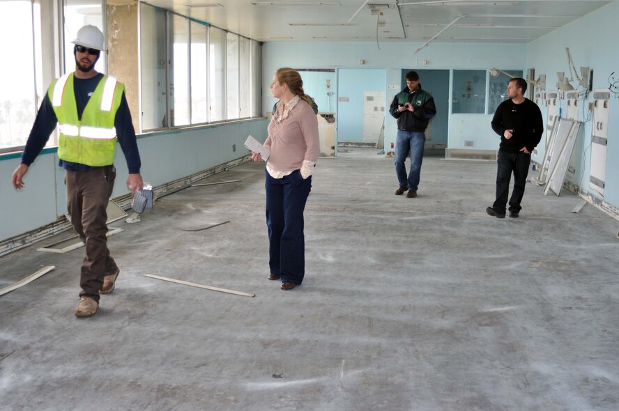 Ryan Morin, U.S. Demolition, Megan Just, Beacon editor, Darren Hughes and Robert Miller, Jr, visit the former March Air Force Base hospital building March 27, 2011, just four days before it is scheduled for demolition to make way for March LifeCare medical facilities.  Hughes is a former employee of the hospital and Miller was born there.  (U.S. Air Force photo/Linda Welz)