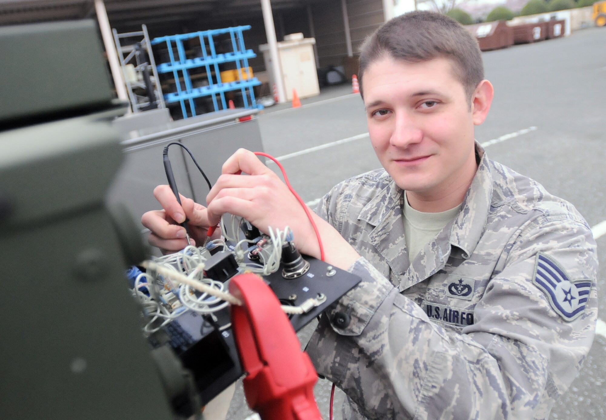 YOKOTA AIR BASE, Japan --Staff Sgt. Patrick Costello, 374th Civil Engineer Squadron, checks the voltage at Yokota Air Base, Japan April 8, 2011. Sergeant Costello, a native of Clinton Ind., is in charge of the electrical power generators, he provides emergency essential power to mission critical functions. Along with his fellow Airmen, Sergeant Costello has been working in support of Operation Tomodachi. (U.S. Air Force photo/Airman 1st Class Krystal M. Garrett) 