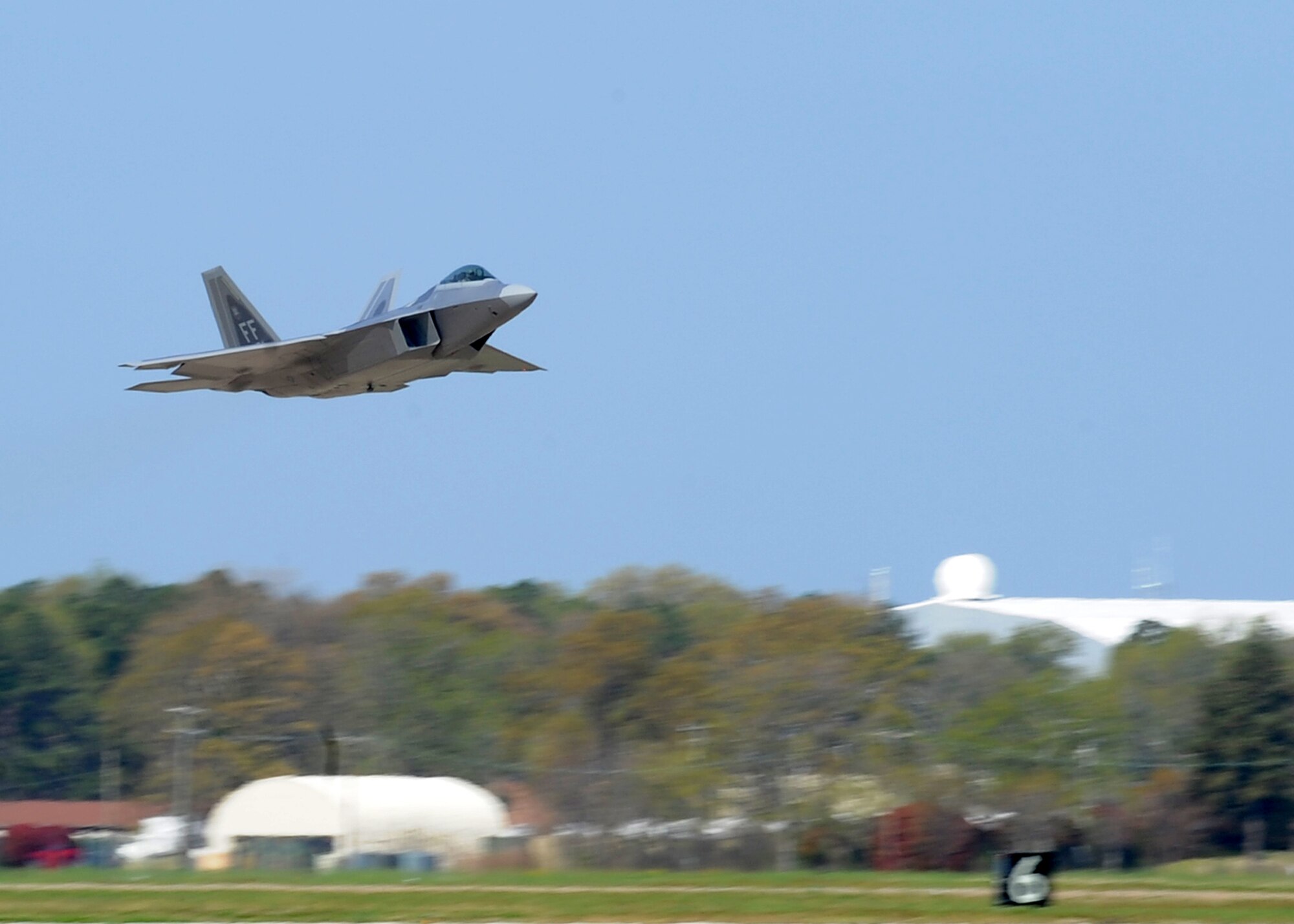 An F-22 Raptor takes off from the runway during the Operational Readiness Inspection at Langley Air Force Base, Va., April 10, 2011. The inspection evaluates an installation's ability to efficiently deploy military members, cargo and equipment while also adjusting to rapidly changing security conditions. (U.S. Air Force Photo/Senior Airman Zachary Wolf)
