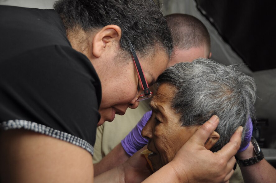 Wendy Raisatta calms her great aunt, Esther Raisatta, 92, as she receives treatment in Cumuto Barracks in Trinidad and Tobago April 9, 2011. Patients traveled from all regions of Trinidad and Tobago to receive care from the Health Response Team (U.S. Air Force photo by 2d Lt Joel Banjo-Johnson/Released)
