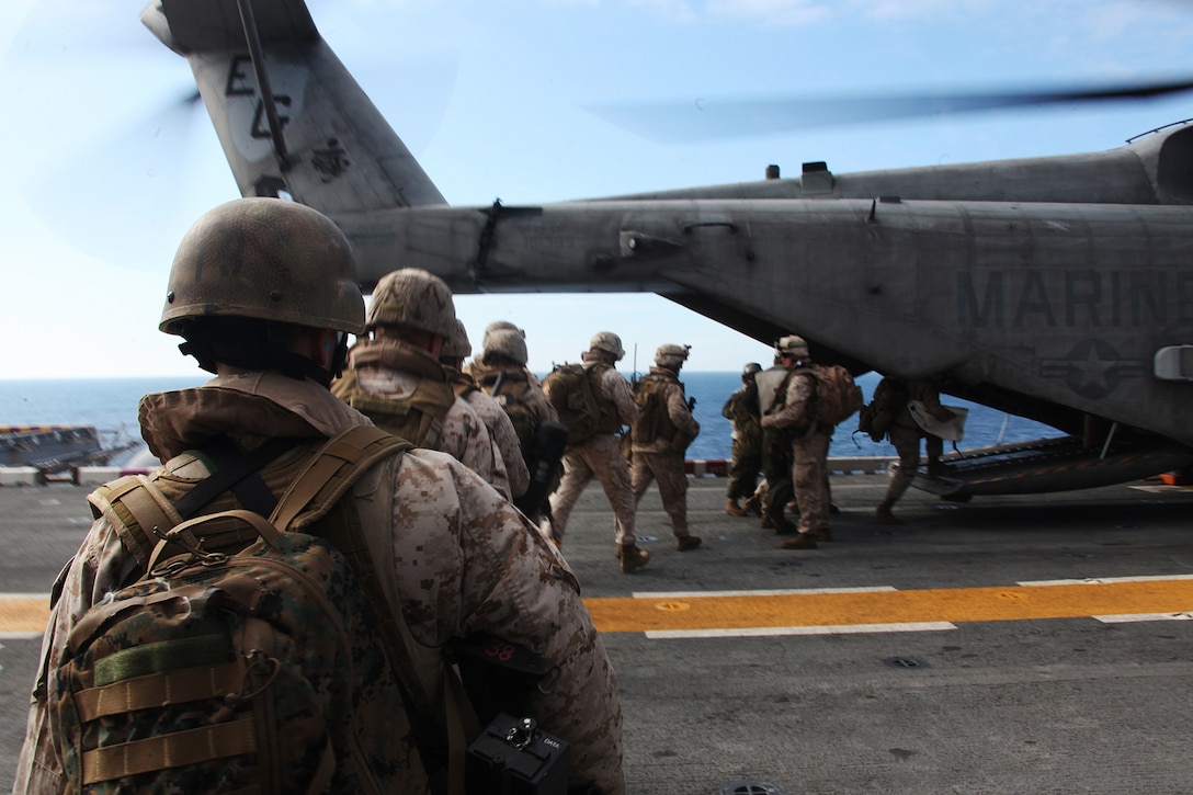 Marines and sailors with Weapons Company, Battalion Land Team, 2nd Battalion, 2nd Marine Regiment, 22nd Marine Expeditionary Unit, load into a CH-53E Super Stallion with Marine Medium Tiltrotor Squadron 263 (Reinforced), aboard USS Bataan during an aviation-borne tactical recovery of aircraft and personnel exercise, April 10, 2011.  The Marines conducted the exercise to enhance their aviation-borne rescue capabilities while deployed.  The Marines and sailors of the 22nd MEU are currently deployed with Amphibious Squadron 6 aboard the USS Bataan Amphibious Ready Group and will continue to train and improve the MEU’s ability to operate as a cohesive and effective Marine Air Ground Task Force.  The 22nd MEU is a multi-mission capable force comprised of Aviation Combat Element, Marine Medium Tiltrotor Squadron 263 (Reinforced); Logistics Combat Element, Combat Logistics Battalion 22; Ground Combat Element, Battalion Landing Team, 2nd Battalion, 2nd Marine Regiment; and its Command Element.