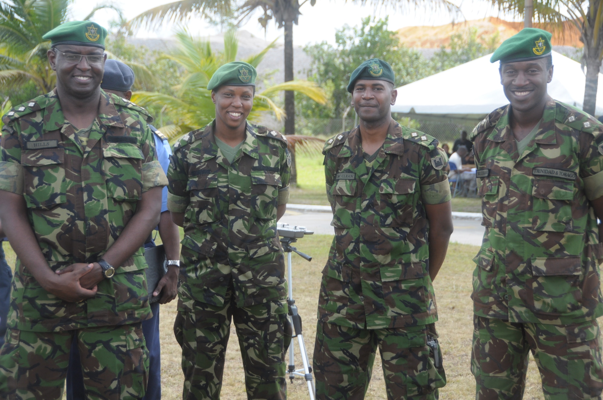 Capt. Jason Hills, Officer Commanding field squadron, Lt. Roxanne Rodney, OC support squadron, Lt Darron McClean, Adjitant, and Lt Olatunji Rodder-Fisher, Operations officer, smile at Cumuto Barracks in Trinidad and Tobago April 11, 2011.  The 1st Engineer Battalion provided base support for the expeditionary medical support health response team during the Allied Forces Humanitarian Exercise or Fuerzas Alidas Humanitarias 2011. (U.S. Air Force Photo/2nd Lt Joel Banjo-Johnson)
