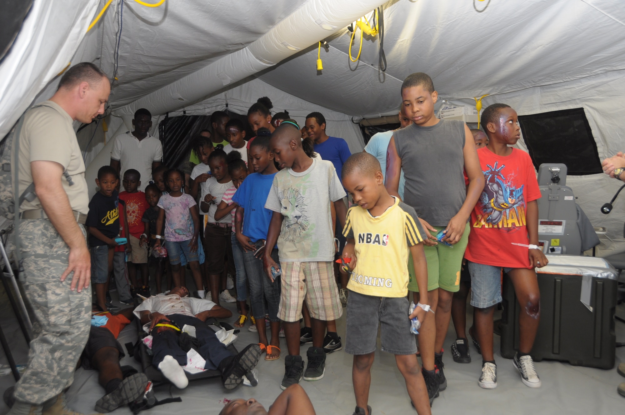 Children of the parents of Trinidad army soldiers acted as injured patients before touring the hospital facility at Cumuto Barracks in Trinidad and Tobago April 11, 2011.  Mock patients volunteered to role play in support of the Allied Forces Humanitarian Exercise or Fuerzas Alidas Humanitarias 2011. (U.S. Air Force Photo/2nd Lt Joel Banjo-Johnson)
