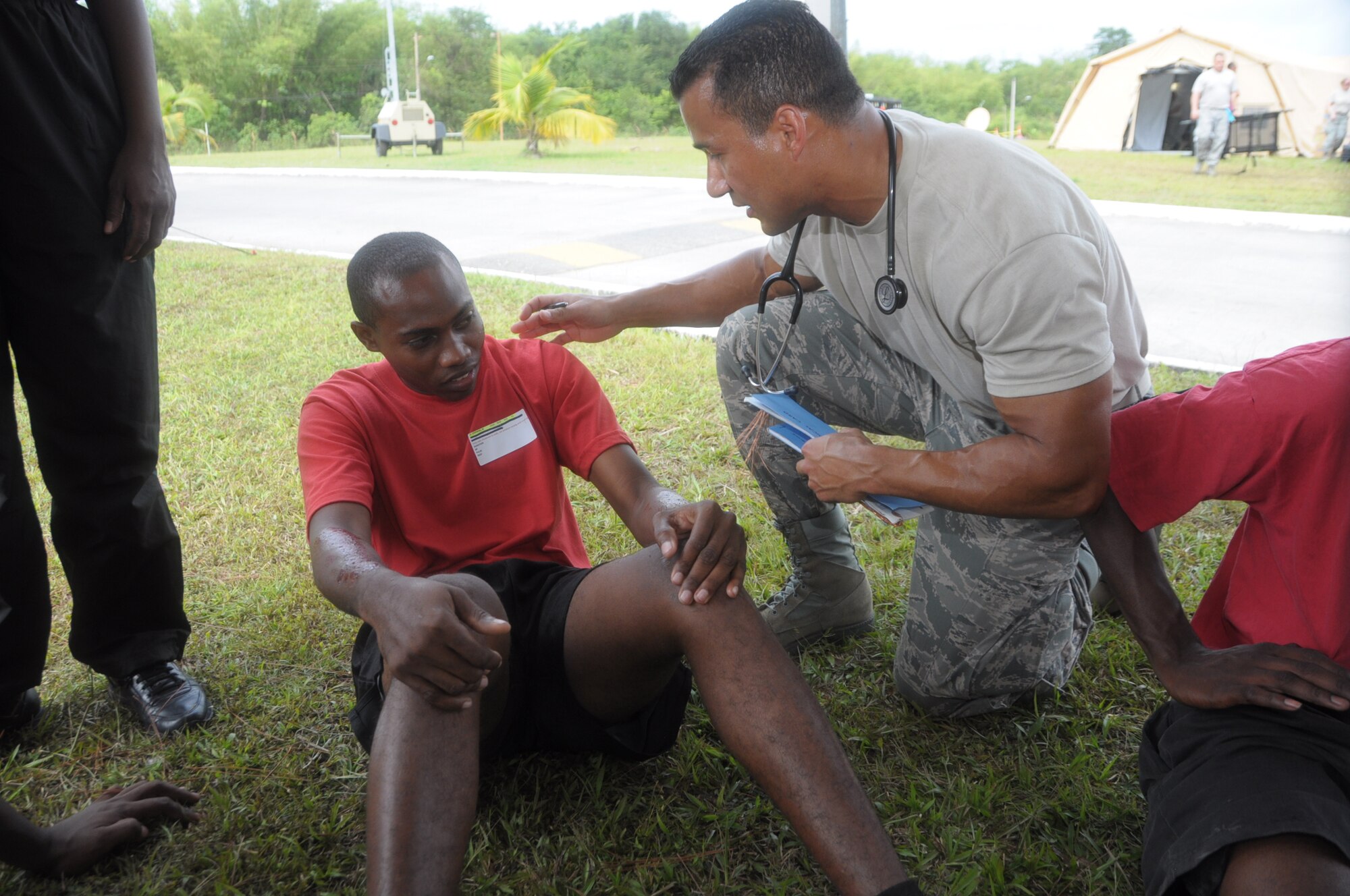 U.S. Air Force Maj. Don Royster, obstetrician from the 60th Medical Group at Travis Air Force Base, Calif., examines a mock trauma patient at Cumuto Barracks in Trinidad and Tobago April 11, 2011. Major Royster is a part of an expeditionary medical support health response team in support of the Allied Forces Humanitarian Exercise or Fuerzas Alidas Humanitarias 2011. (U.S. Air Force Photo/2nd Lt Joel Banjo-Johnson)
