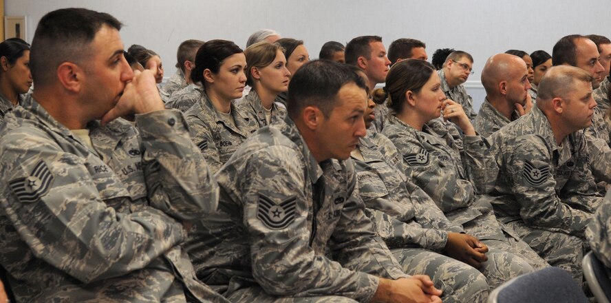 Airmen and civilians of the 2nd Bomb Wing Staff Agencies attentively listen during an All Call held at Chapel 2 on Barksdale Air Force Base, La., April 8. The All Call was held to discuss the way forward in the event of a government shutdown. (U.S. Air Force Photo/Senior Airman La'Shanette V. Garrett) (RELEASED)